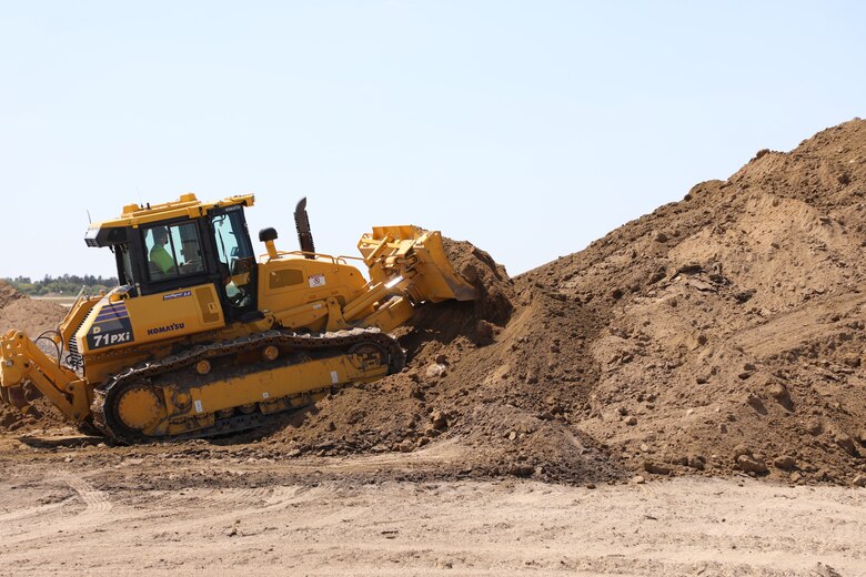 Tractor performs site work at Minot AFB, ND, Aug. 15, 2023.