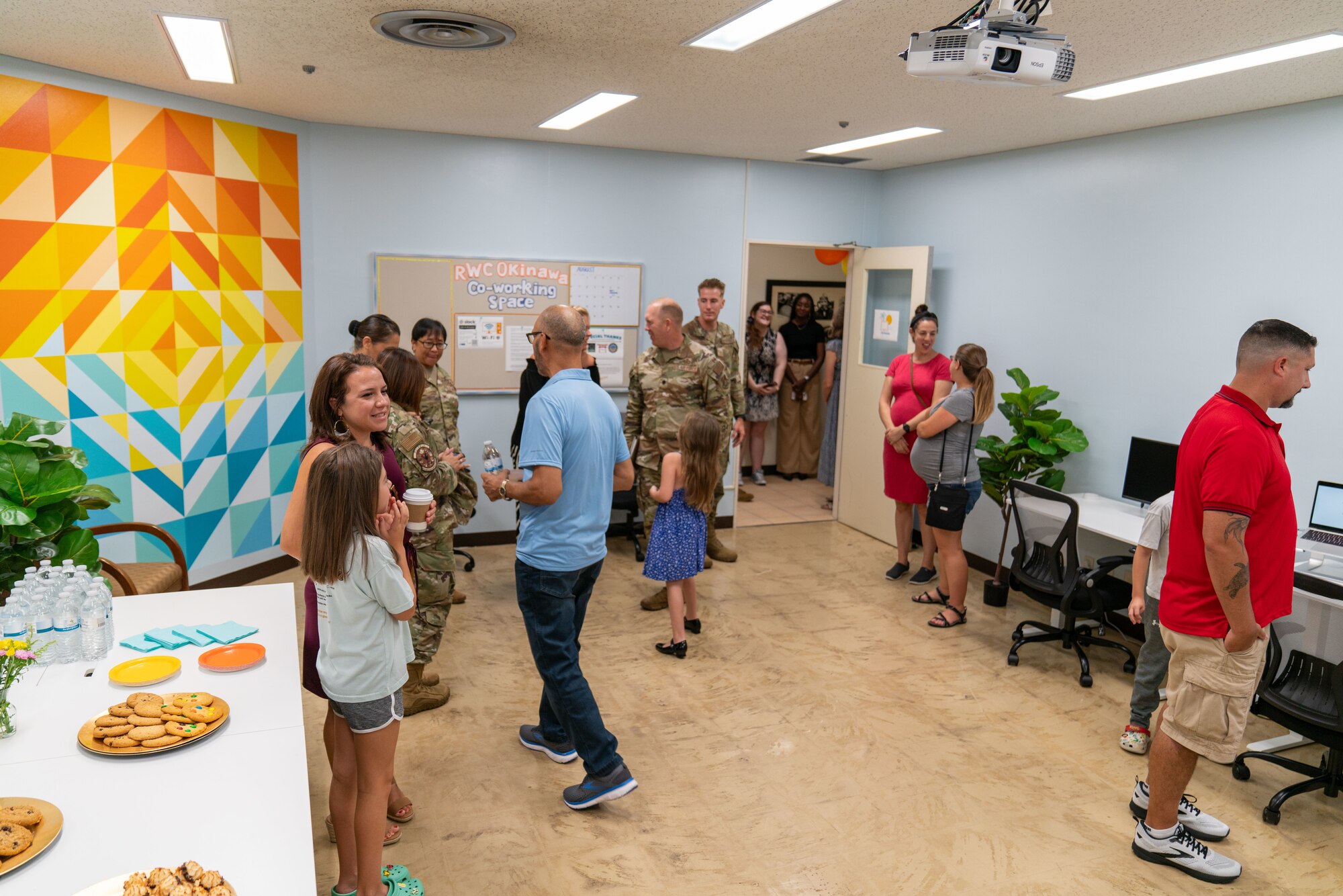 People explore a coworking room.