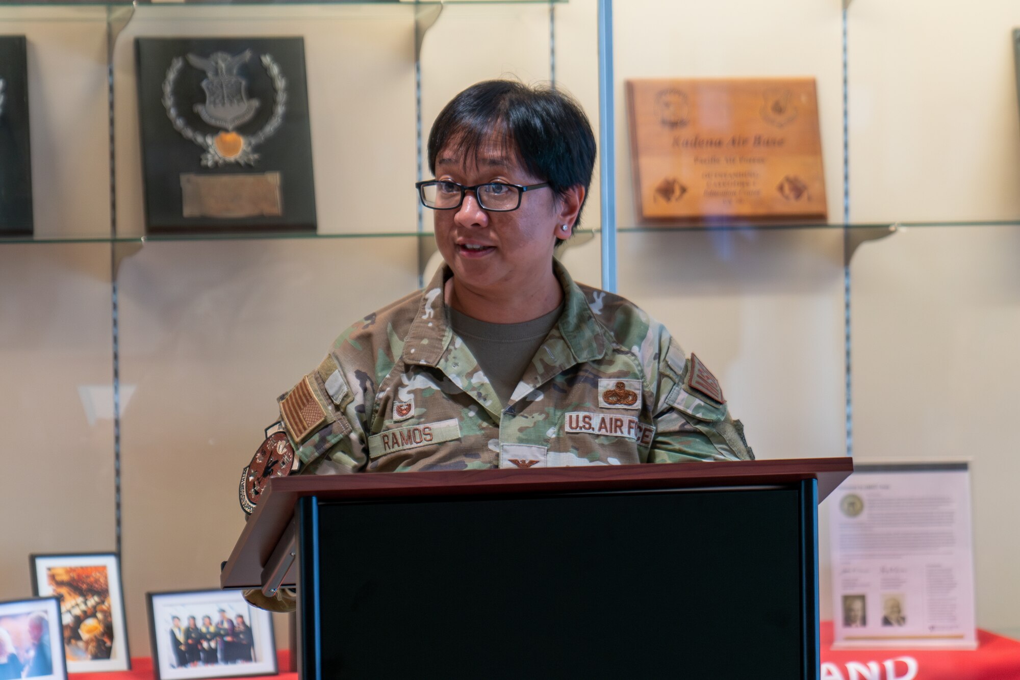 An Airman speaks during a ceremony.