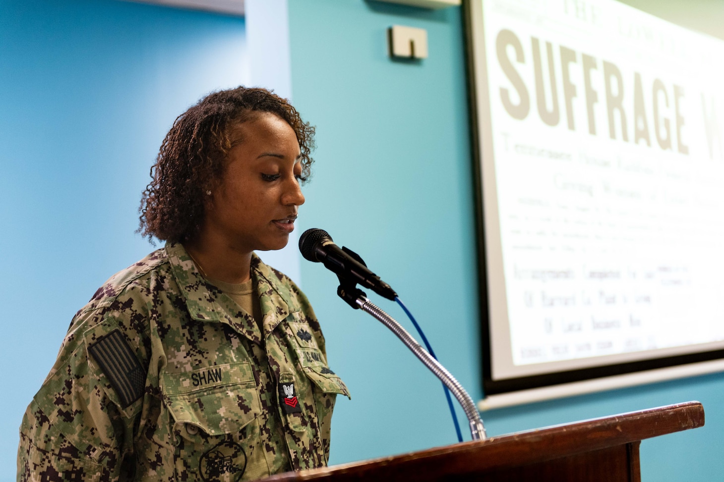 Utilitiesman 1st Class Jamiah Shaw, assigned to Naval Support Activity Souda Bay, discusses historical and contemporary figures influential to the advancement of women’s equality and provides personal reflections on the importance of women’s equality in society during an early commemoration of Women’s Equality Day on Aug. 18, 2023.