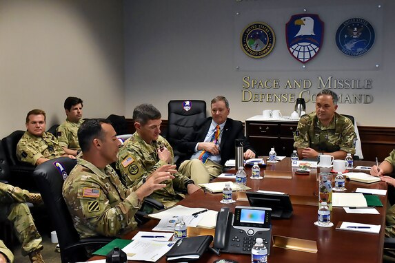 United Kingdom Royal Air Force Air Commodore Adam Bone, right, U.K. Space Command director of operations, plans and training talks about the synergies between the U.K. Space Command and the U.S. Army Space and Missile Defense Command and the U.K.’s status as a military space power during his visit to USASMDC’s headquarters Aug. 9 on Redstone Arsenal, Ala. (U.S. Army photo by Cecil Longino)