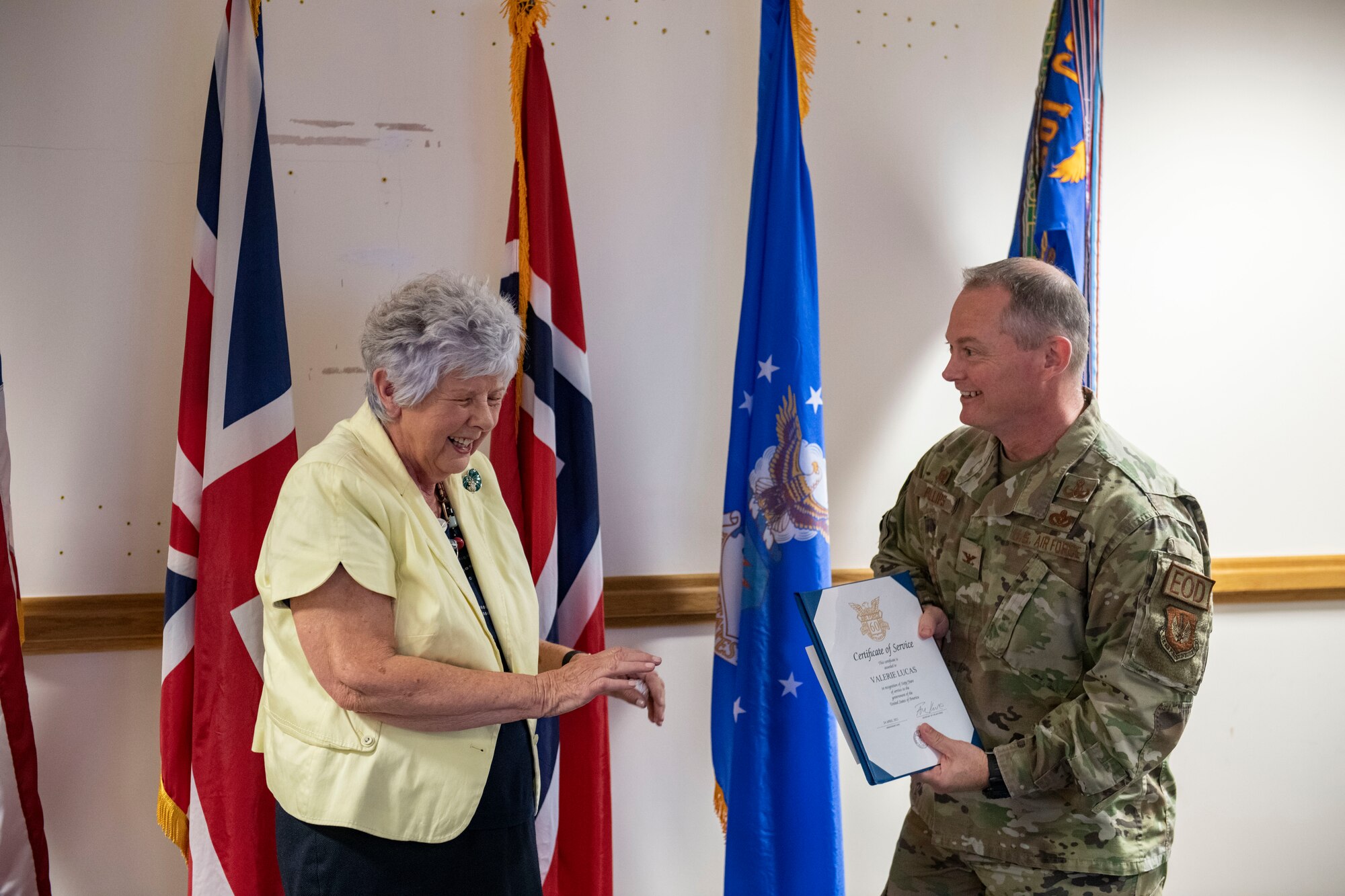 Valarie Lucas, 501st Combat Support Wing british liaison officer, left, and Col. D. Landon Phillips, 501st CSW commander, laugh together at RAF Alconbury