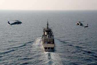 HSC-9 flies alongside the Hellenic Navy frigate HS Elli (F450).