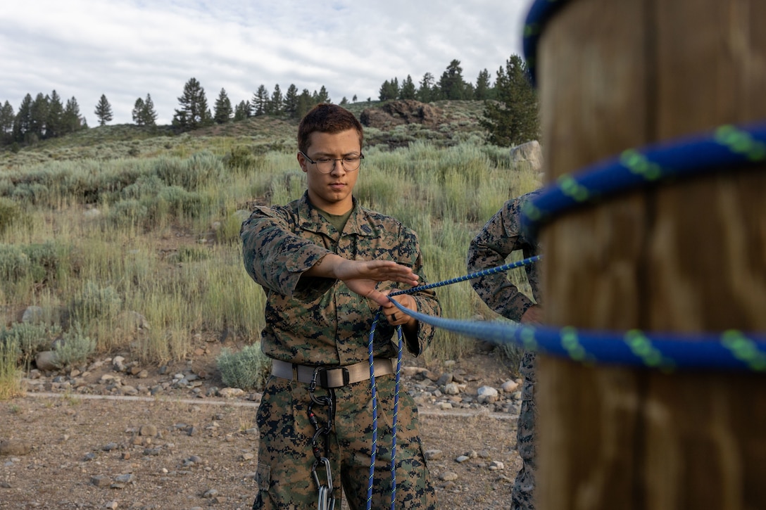 U.S. Navy Seamen Apprentice Anthony Martinez, a student with Mountain Medicine (MMED) 1-23, learns knot tying techniques during Mountain Medicine (MMED) 1-23 at Marine Corps Mountain Warfare Training Center, Bridgeport, California, July 17, 2023. MMED challenges service members with various medical and technical problems common to mountainous environments in preparation for future conflicts in austere terrain. (U.S. Marine Corps photo by Lance Cpl. Anna Higman)