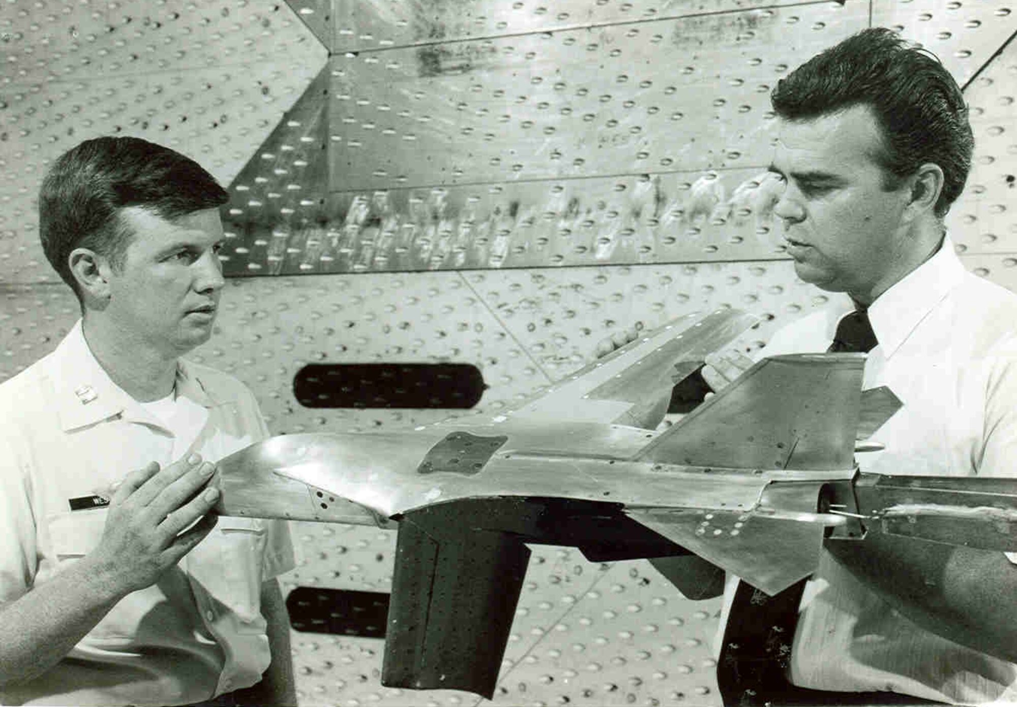 Dale Bradley, right, and Capt. Walter West examine a scale model of an aircraft fitted with a mission adaptive wing in the early 1980s at Arnold Air Force Base, Tenn. The mission adaptive wing concept involved varying the wing’s camber, which refers to the convexity of the airfoil, to assess impact on aerodynamic performance. This was among numerous projects with which Bradley was involved during his 33-year career at Arnold. (U.S. Air Force photo)