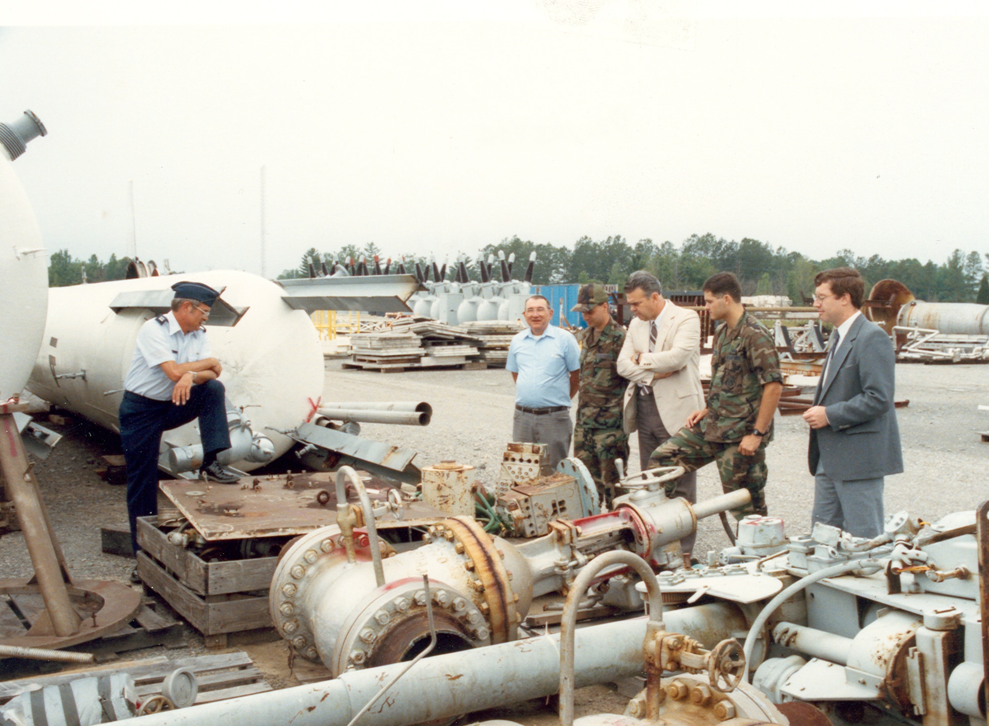 Dale Bradley, third from right, joins others at Arnold Air Force Base, Tenn., in inspecting cryogenic hardware acquired by Arnold Engineering Development Complex from the NASA Lewis Research Center in the early 1990s. The resurrection of the cryogenic capability at Arnold was among the numerous projects with which Bradley was involved during his 33-year career at Arnold. (U.S. Air Force photo)