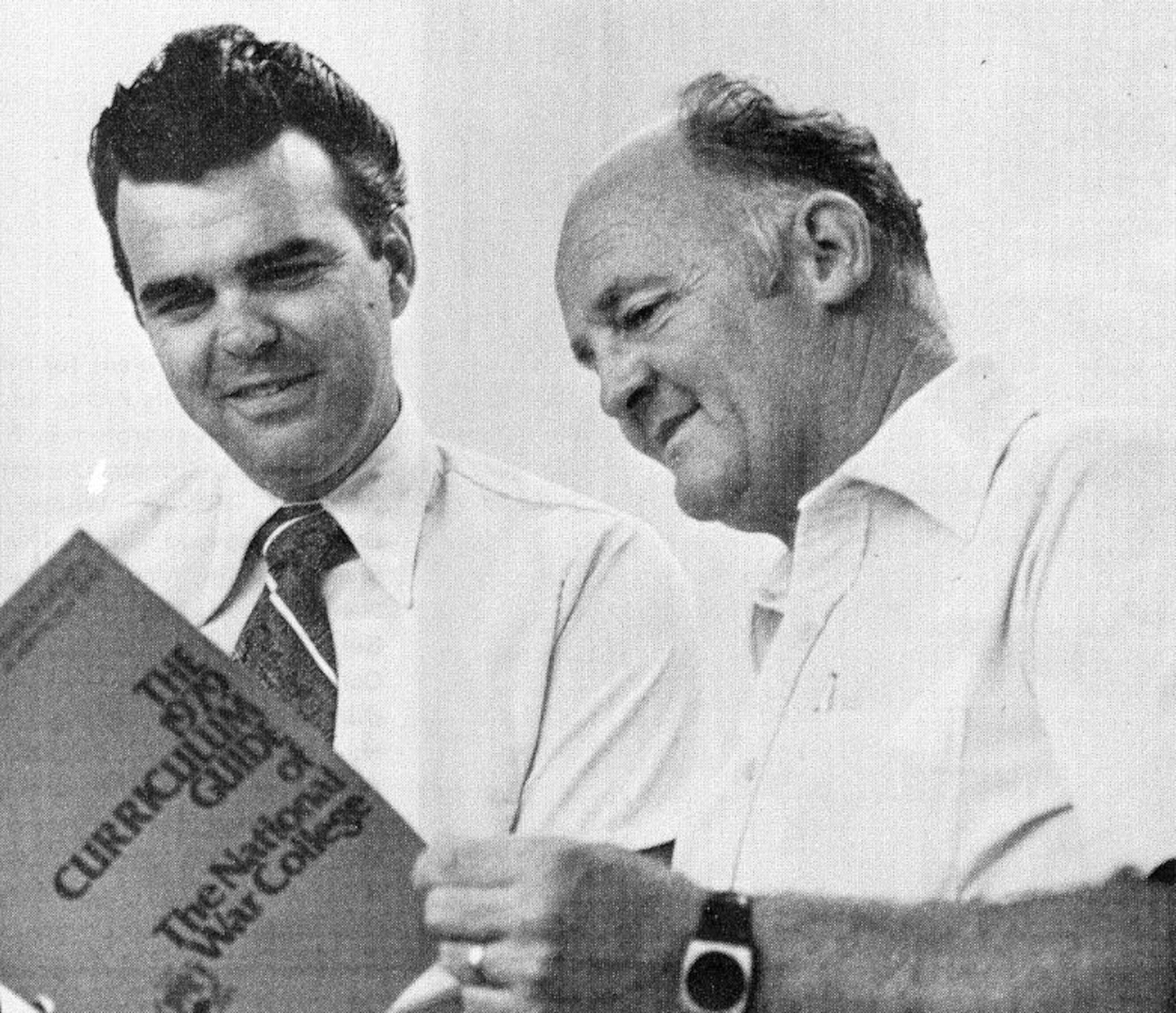 Dale Bradley, left, and Dick Austin, both employed at Arnold Air Force Base, Tenn., look over the curriculum of the National War College in Washington, D.C., in the late 1970s. (U.S. Air Force photo)