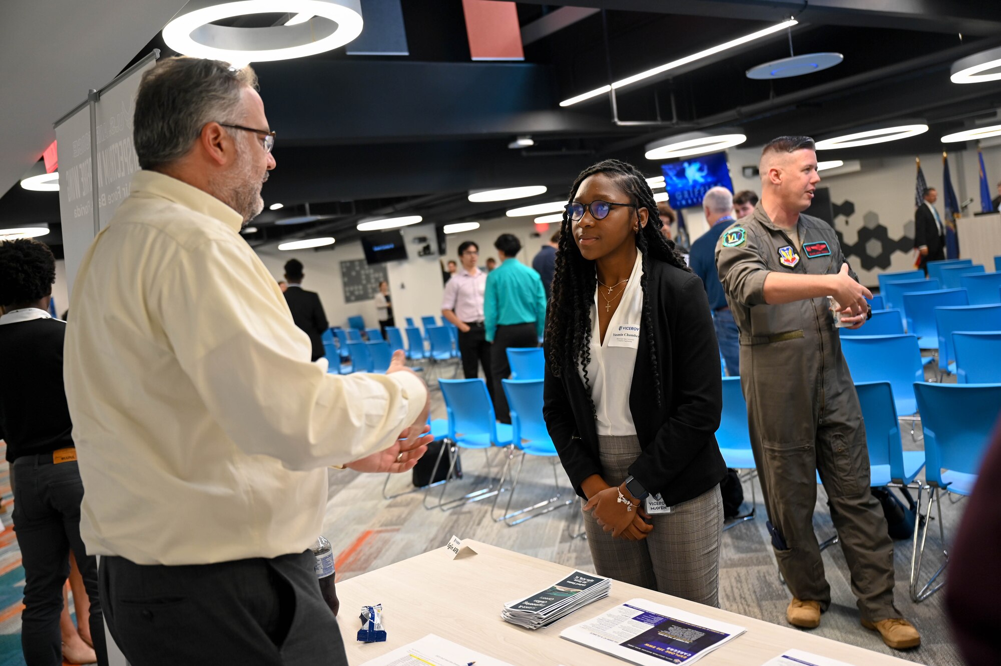 Michael John Rafferty, 16th Electronic Warfare Squadron chief engineer, talks with Yasmin Chambers, Virtual Institutes for Cyber and Electromagnetic Spectrum Research and Employ (VICEROY) MAVEN intern, about intern and career opportunities at the 350th Spectrum Warfare Wing during the VICEROY MAVEN graduation at The Griffiss Institute, Rome, New York, Aug. 4, 2023. The VICEROY Program aims to excite VICEROY students about solving unique DoD research and operational problems, while learning about the exceptional benefits of a DoD career. (U.S. Air Force photo by Capt. Benjamin Aronson)