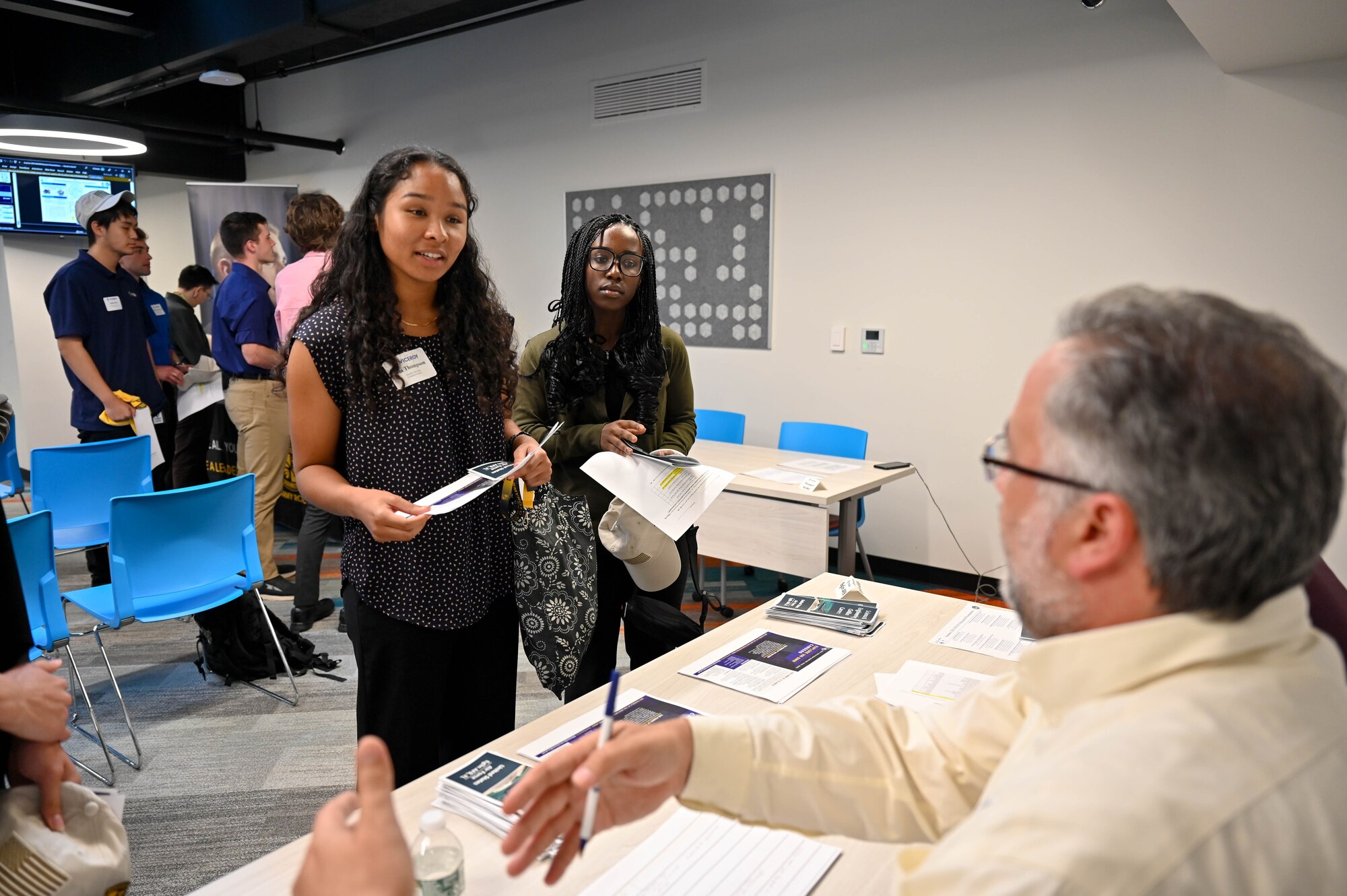 Two Virtual Institutes for Cyber and Electromagnetic Spectrum Research and Employ (VICEROY) MAVEN interns talk with members of the 350th Spectrum Warfare Wing about the mission and potential intern or career opportunities during the VICEROY MAVEN graduation at The Griffiss Institute, Rome, New York, Aug. 4, 2023. The 350th SWW hosted seven VICEROY interns this past summer across four squadrons as part of their second year in the VICEROY Program. (U.S. Air Force photo by Capt. Benjamin Aronson)