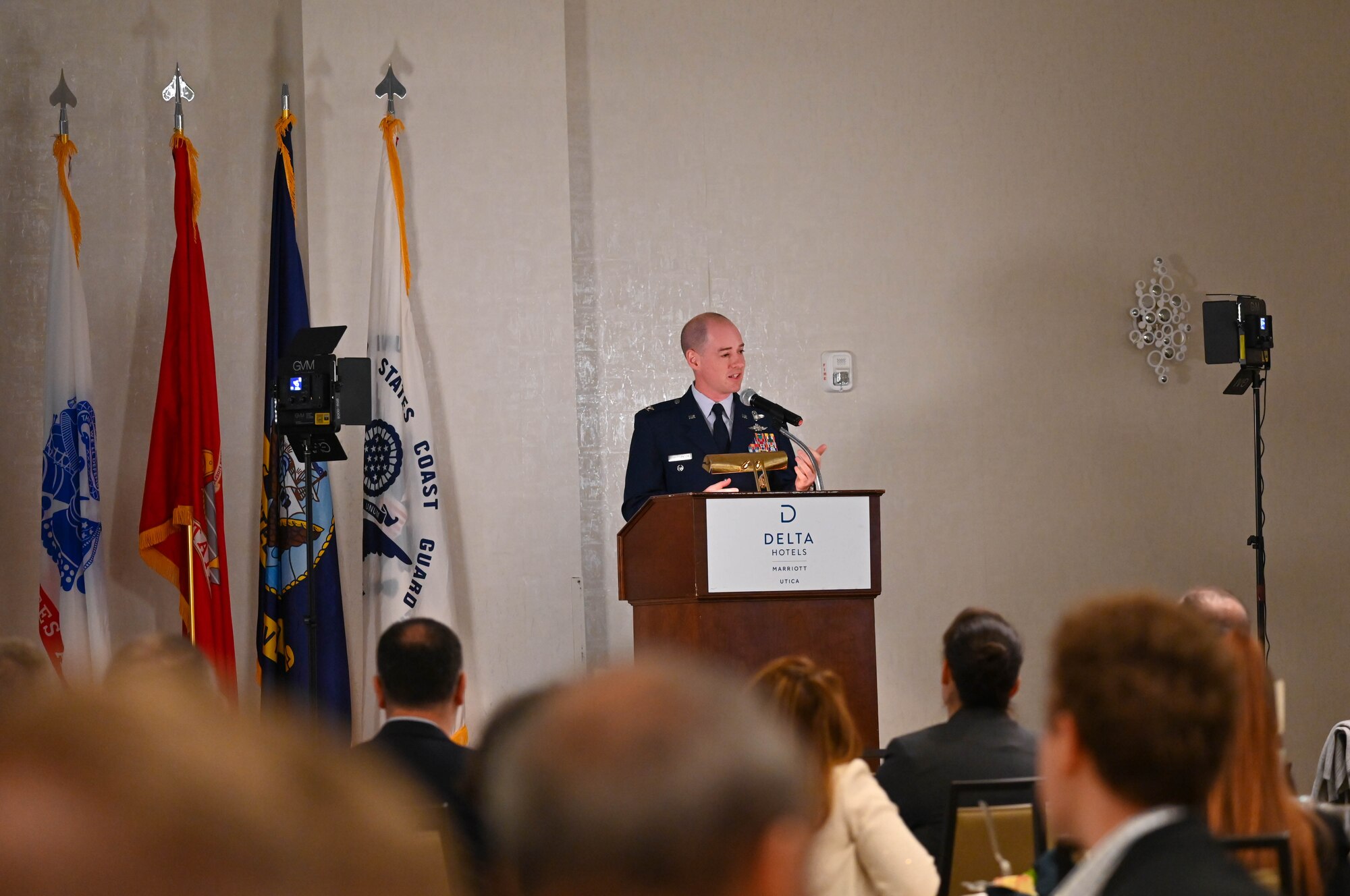 U.S. Air Force Col. John Christianson, 350th Spectrum Warfare Wing deputy commander, speaks at the Virtual Institutes for Cyber and Electromagnetic Spectrum Research and Employ (VICEROY) MAVEN graduation ceremony, Utica, New York, Aug. 4, 2023. The wing hosted seven interns this past summer that worked on mission sets such as integrating AI to speed up aircraft reprogramming, building threat representative test models for bombers and F-35s, improving multi-level data analysis processes using new algorithms and improving missile assessment in large force exercises. (U.S. Air Force photo by Capt. Benjamin Aronson)