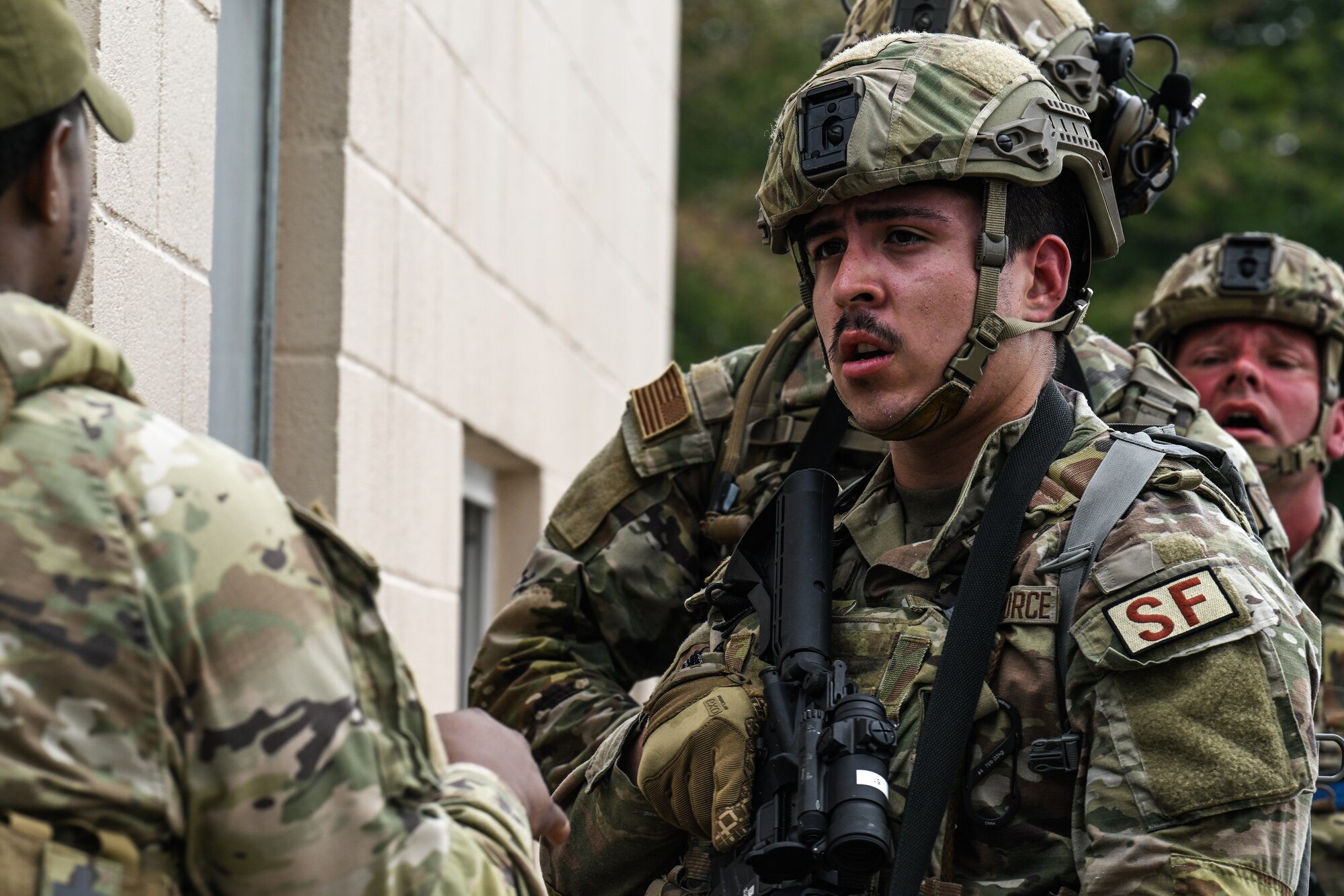 Airman 1st Class Trent Gilwood, a Defender assigned to the 349th Security Forces Squadron, Travis Air Force Base, California, receives instructions during a tactical combat casualty care exercise on Aug. 16, 2023, at Youngstown Air Reserve Station, Ohio.