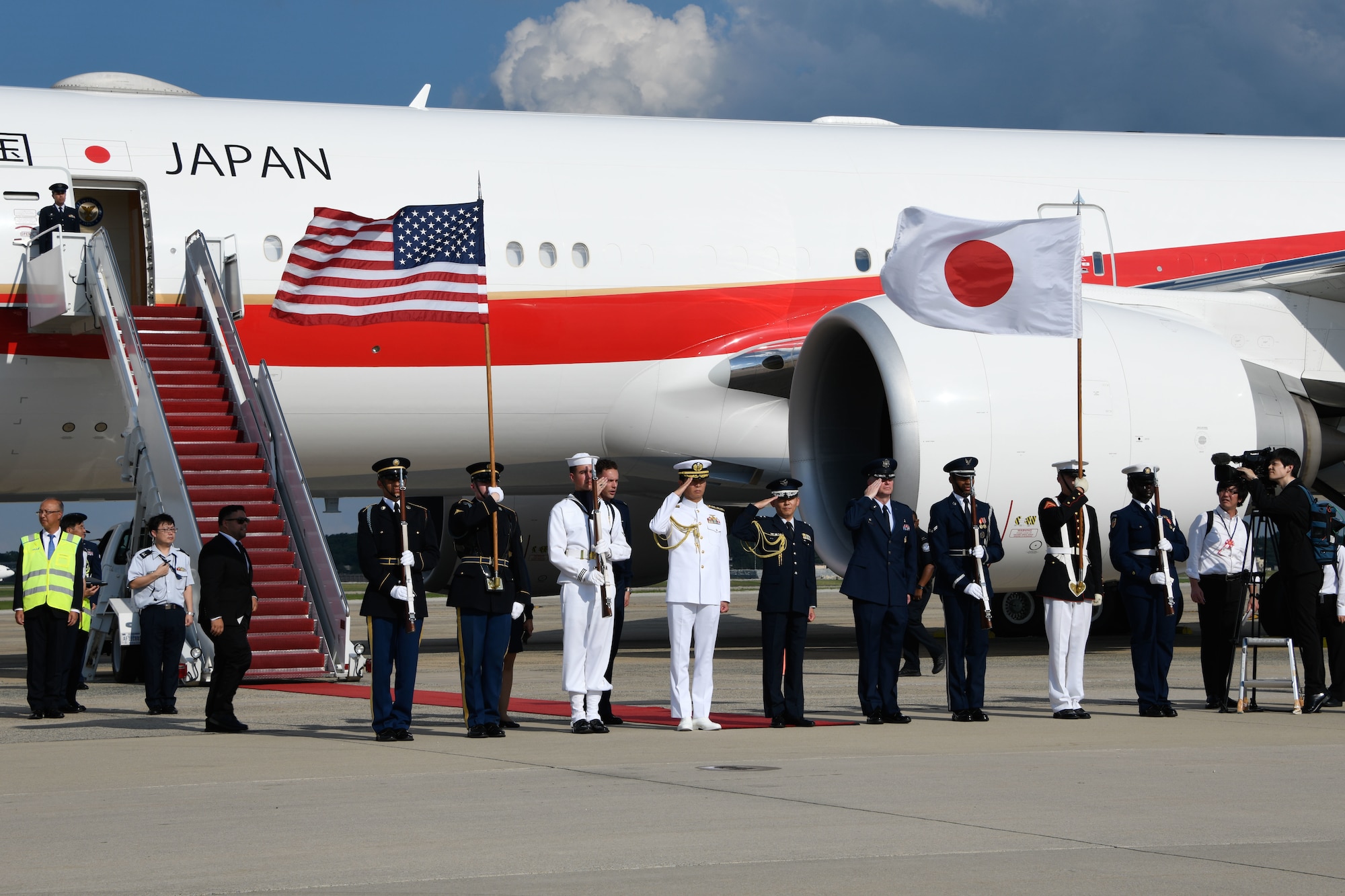 A joint service color guard salutes Japanese Prime Minister Fumio Kishida as he departs the flight line at Joint Base Andrews, Md., Aug. 17, 2023.