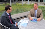 Mr. Mike Emerson, director of marine transportation systems, meets with Todd Muehlenbeck, acting deputy director of marine transportation systems on detail from Customers & Border Patrol, during a mentoring session at Coast Guard headquarters.