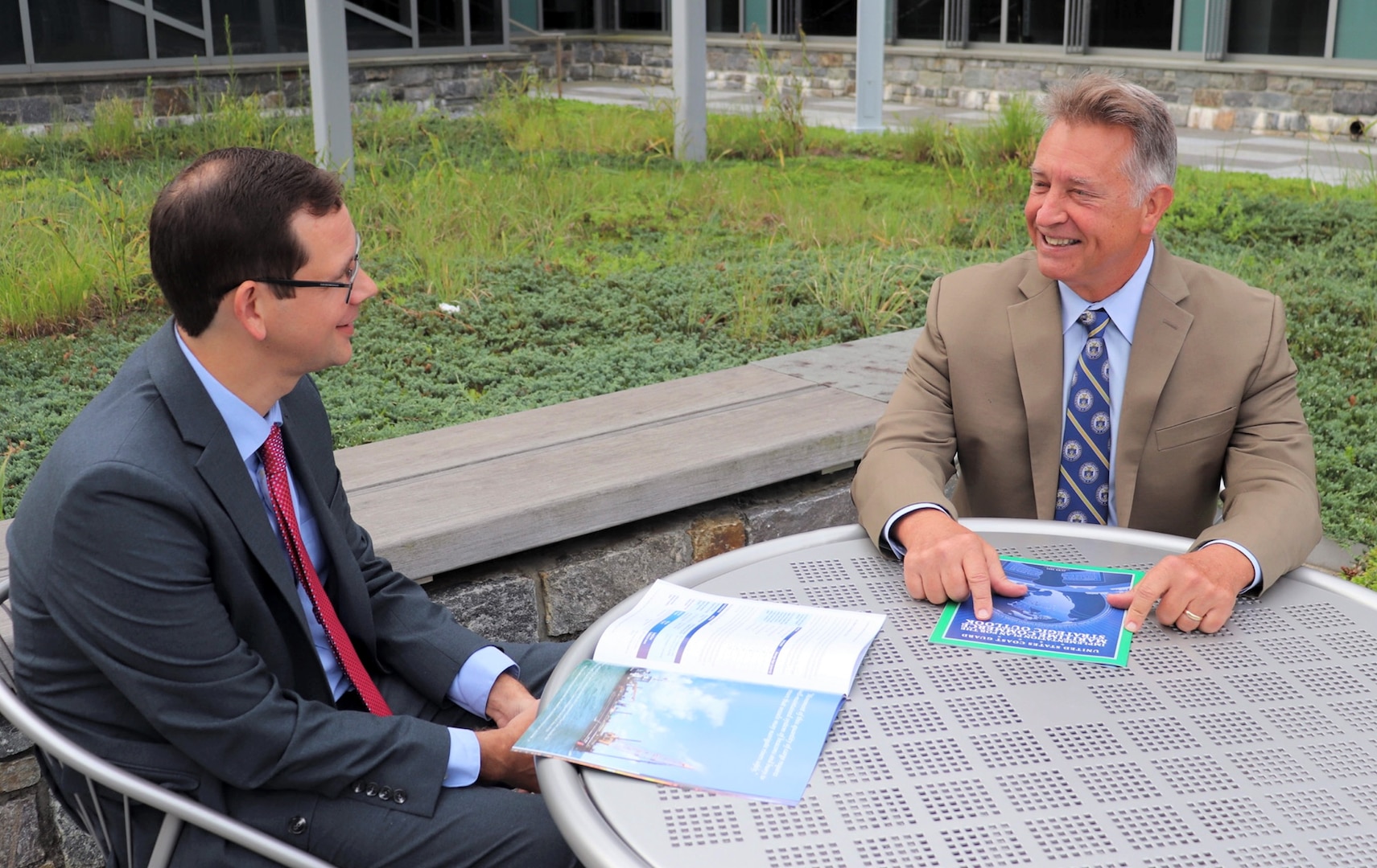 Mr. Mike Emerson, director of marine transportation systems, meets with Todd Muehlenbeck, acting deputy director of marine transportation systems on detail from Customers & Border Patrol, during a mentoring session at Coast Guard headquarters.