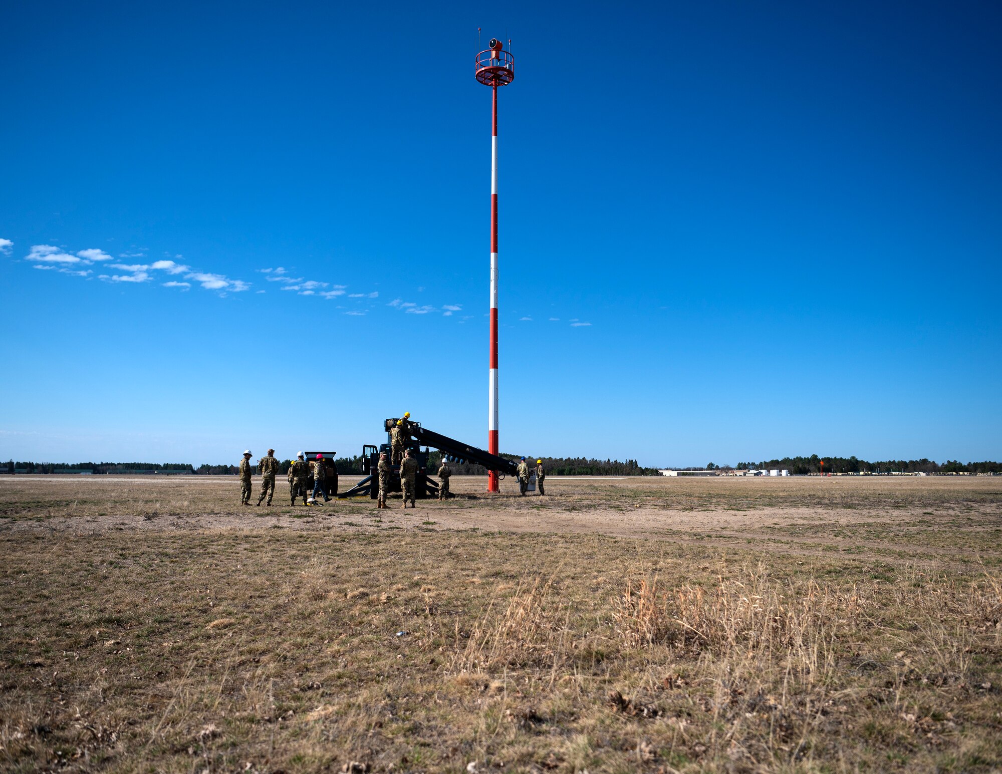 U.S. Air Force Airmen from the 210th Engineering Installation Squadron conduct a preventative maintenance inspection on the glide slope and light beacon tower at Camp Ripley, Little Falls, Minn., May 5, 2023.