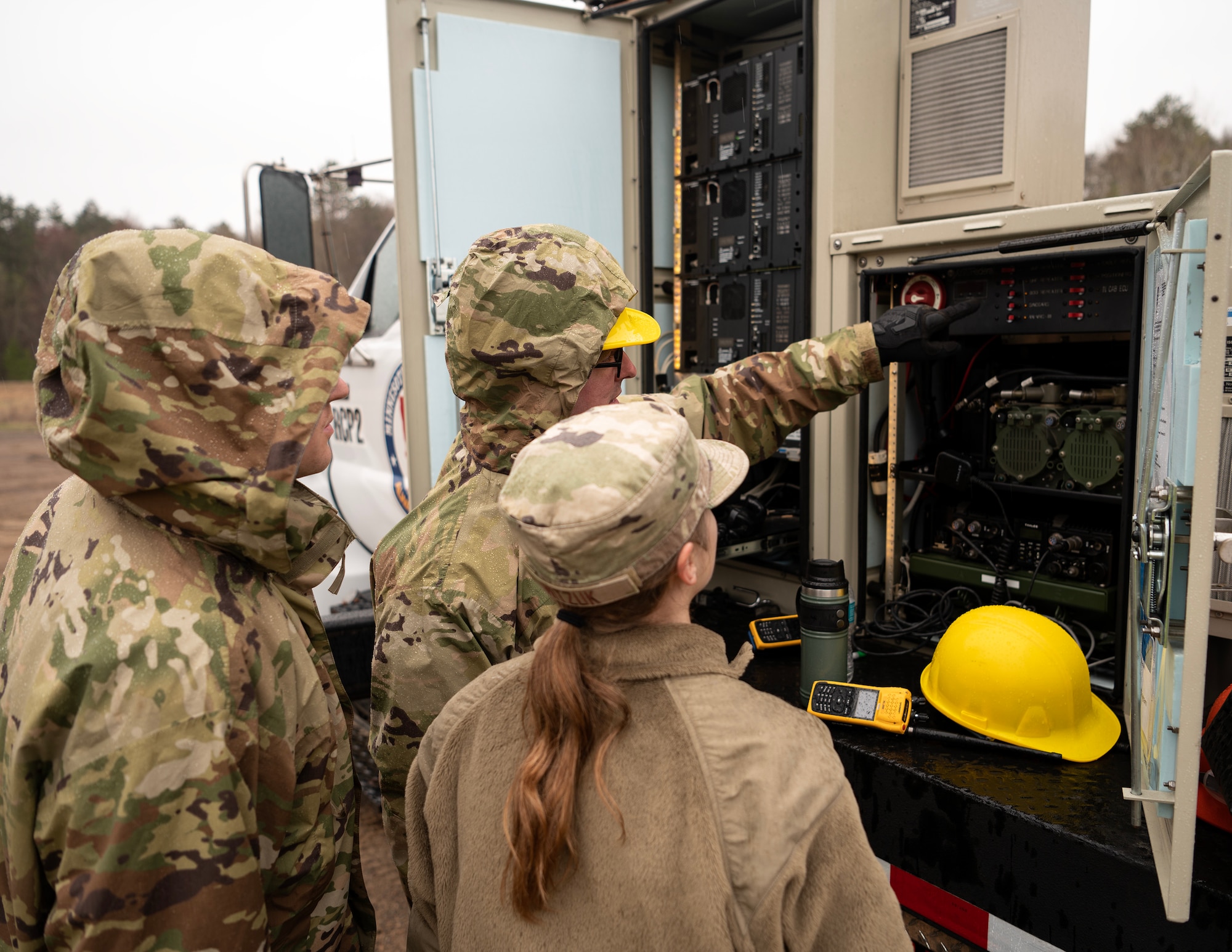 U.S. Air Force Airmen from the 210th Engineering and Installation Squadron gather around their Remote Communication Platform (RCP) to perform domestic operations training at Camp Ripley, Little Falls, Minn., May 5, 2023.