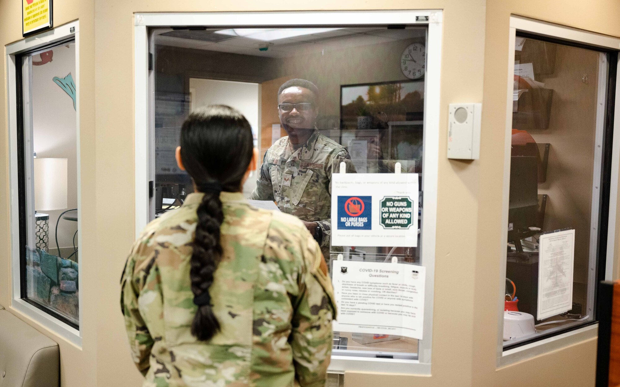 Senior Airman Kiige, 2nd Medical Group mental health technician, speaks to Senior Airman Emma Gomez-Felix, 2nd Medical Group ADAPT technician.