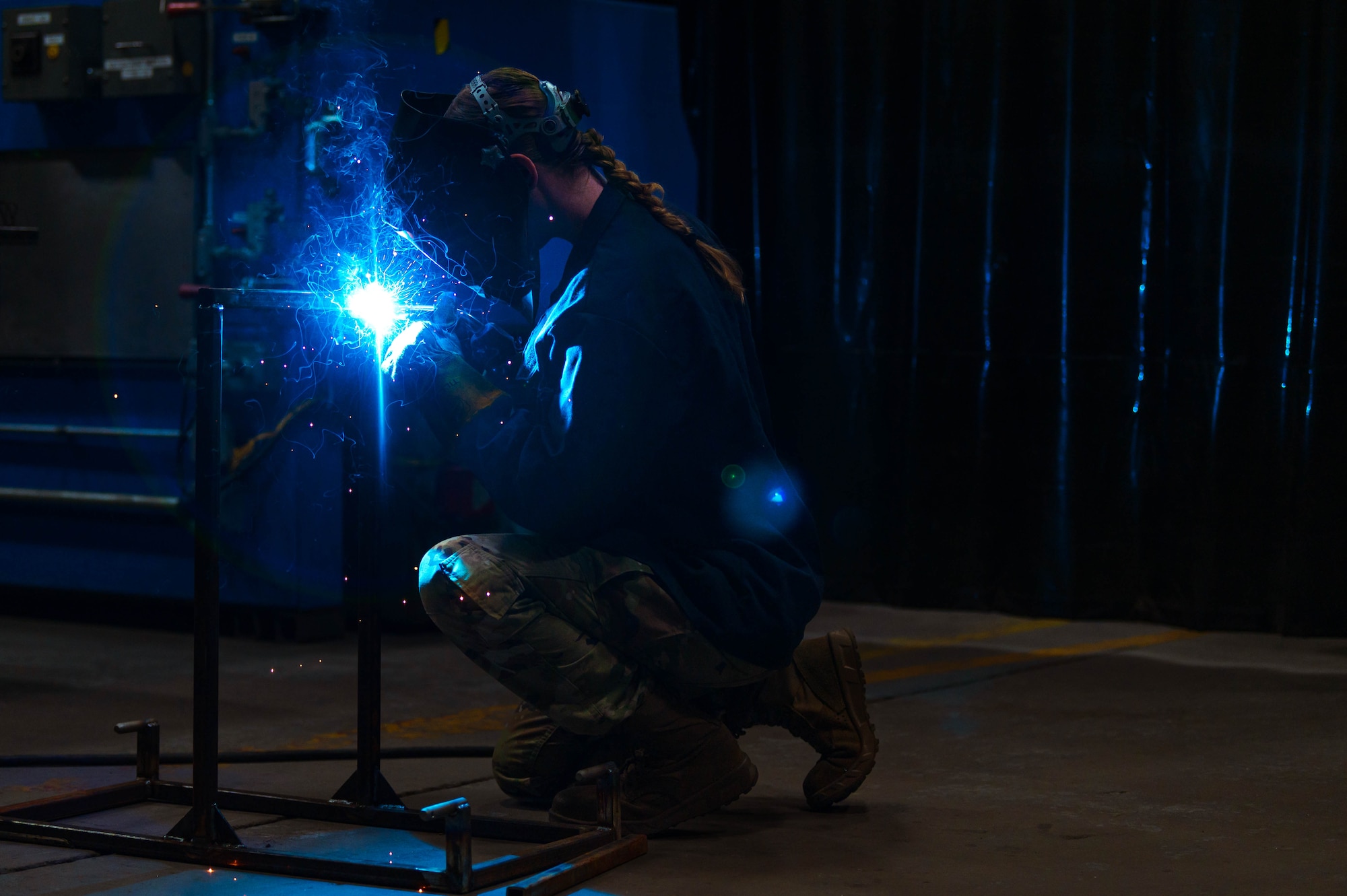 U.S. Air Force Airman 1st Class Kamryn Giddings, 56th Equipment Maintenance Squadron metals technology apprentice, performs metal inert gas welding.