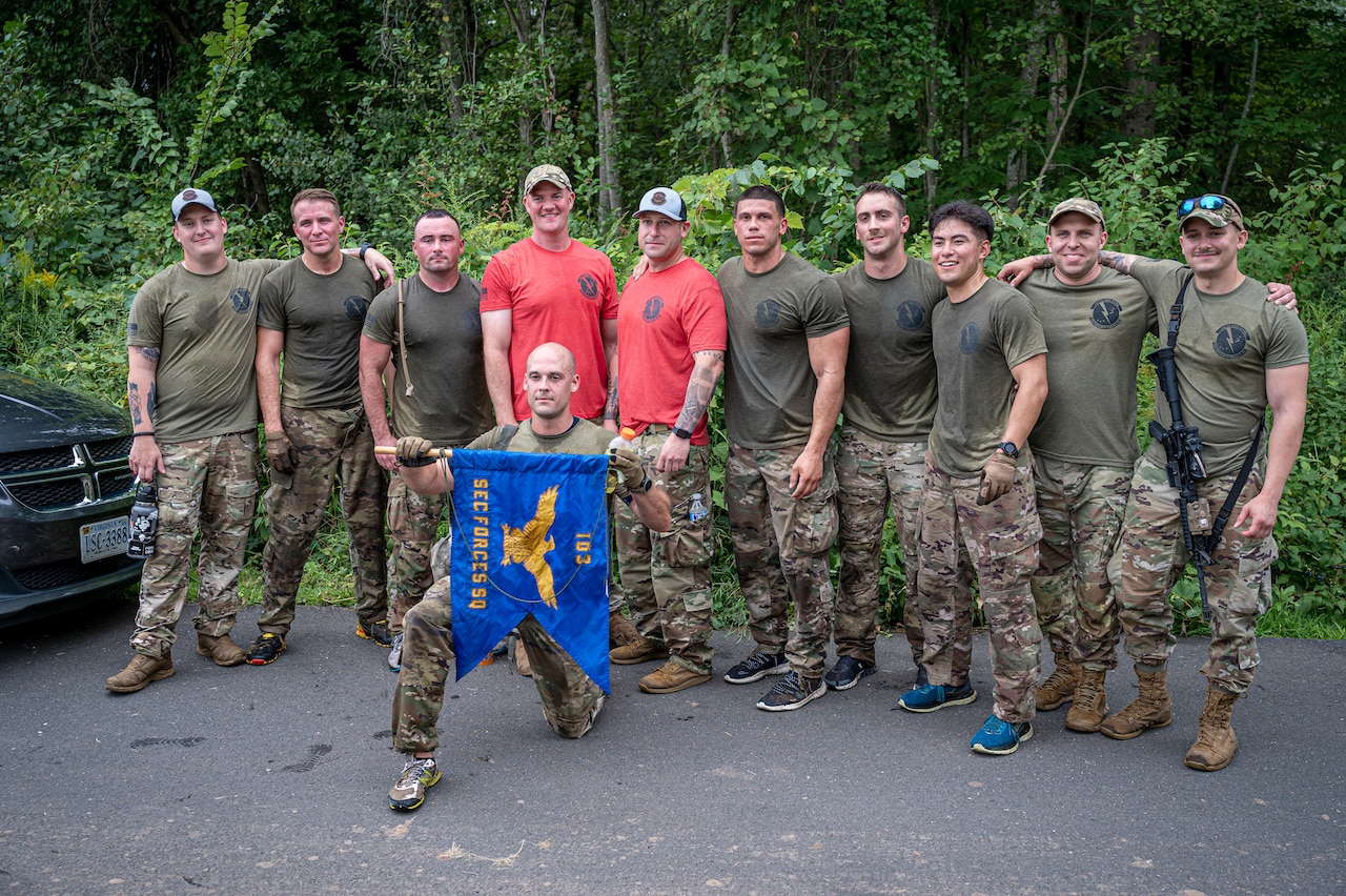 Airmen pose for a photo.
