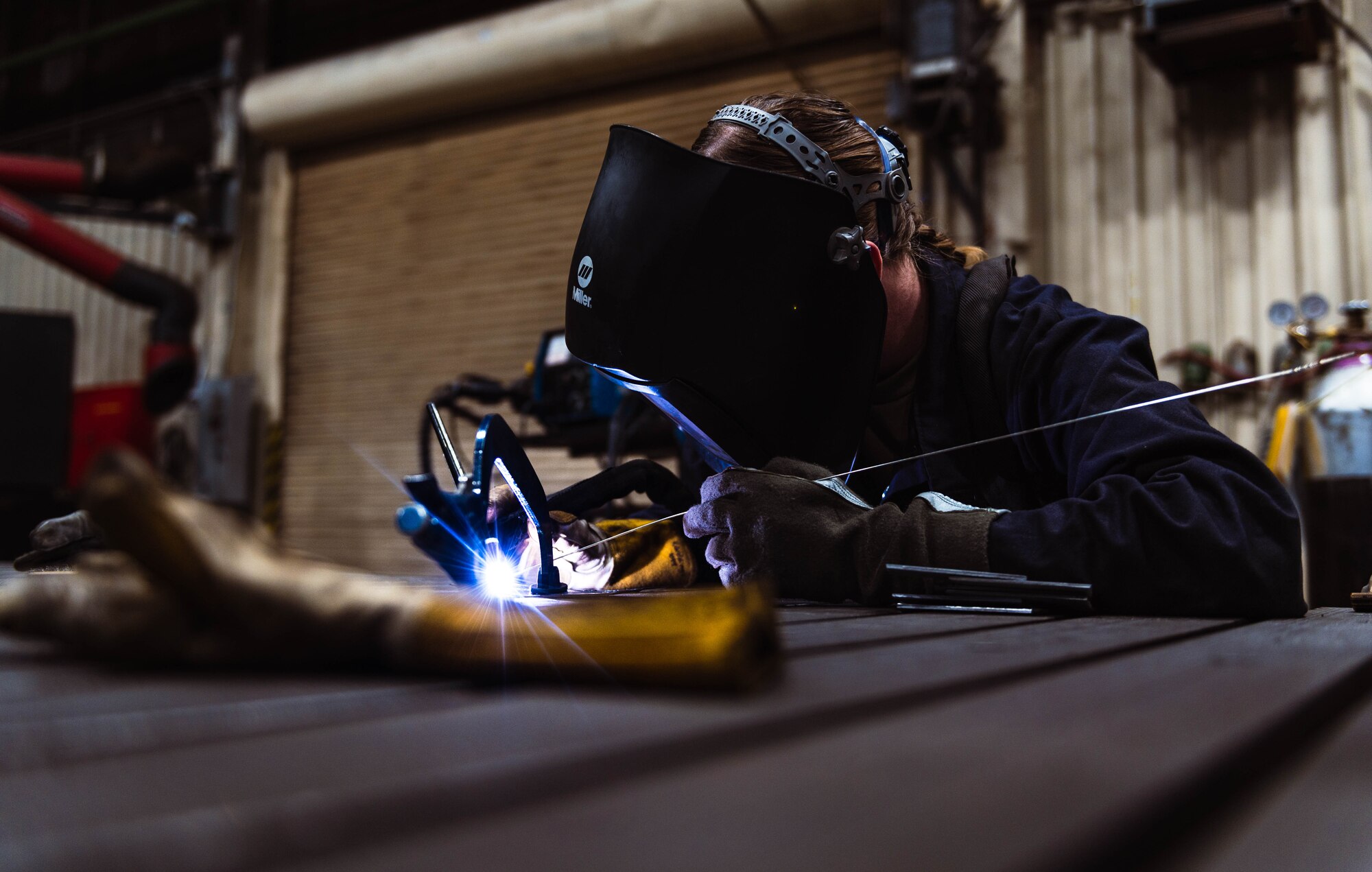 U.S Air Force Airman 1st Class Kamryn Giddings, 56th Equipment Maintenance Squadron metals technology apprentice, performs metal inert gas welding.