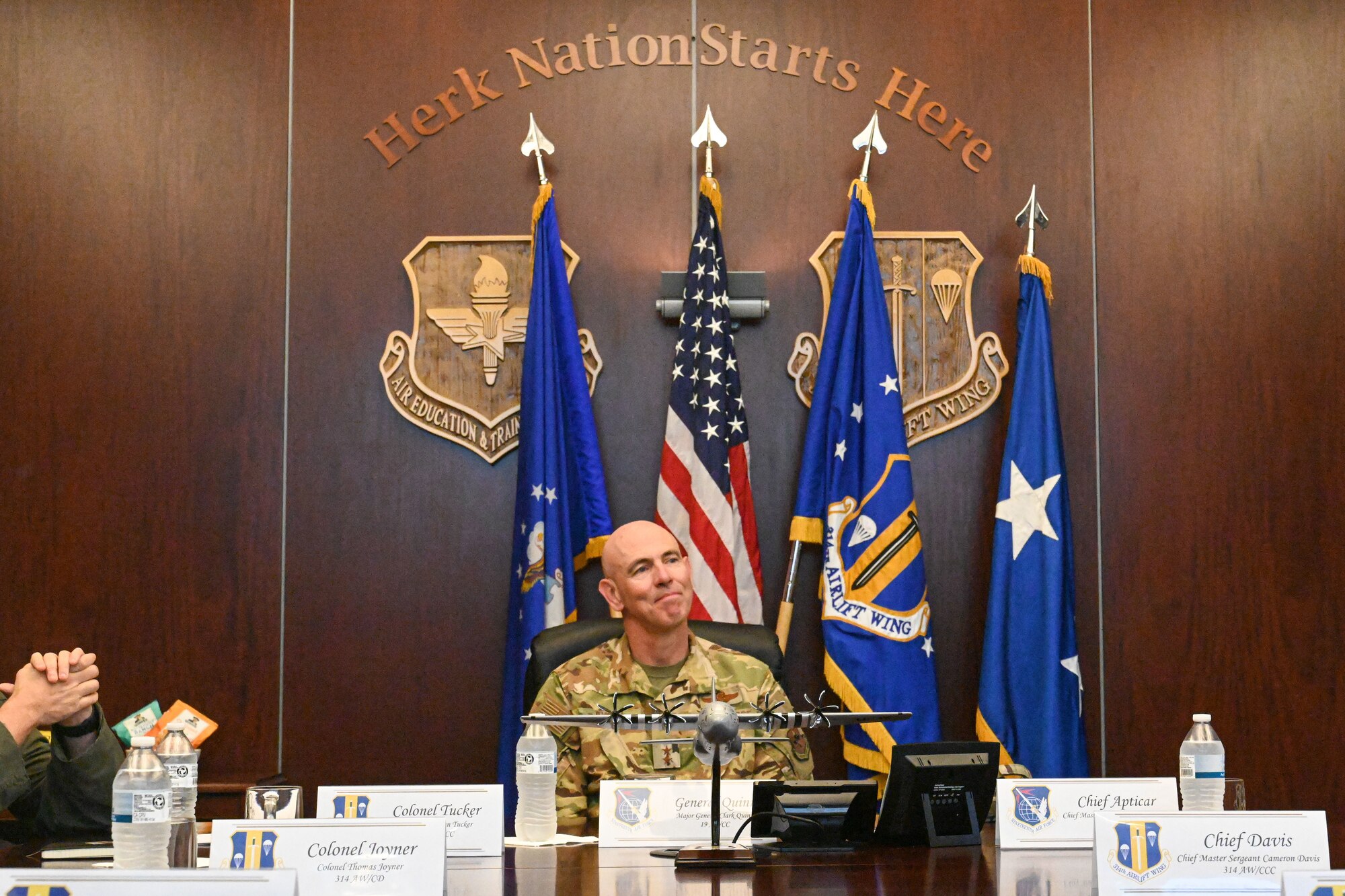 man in uniform attends a briefing