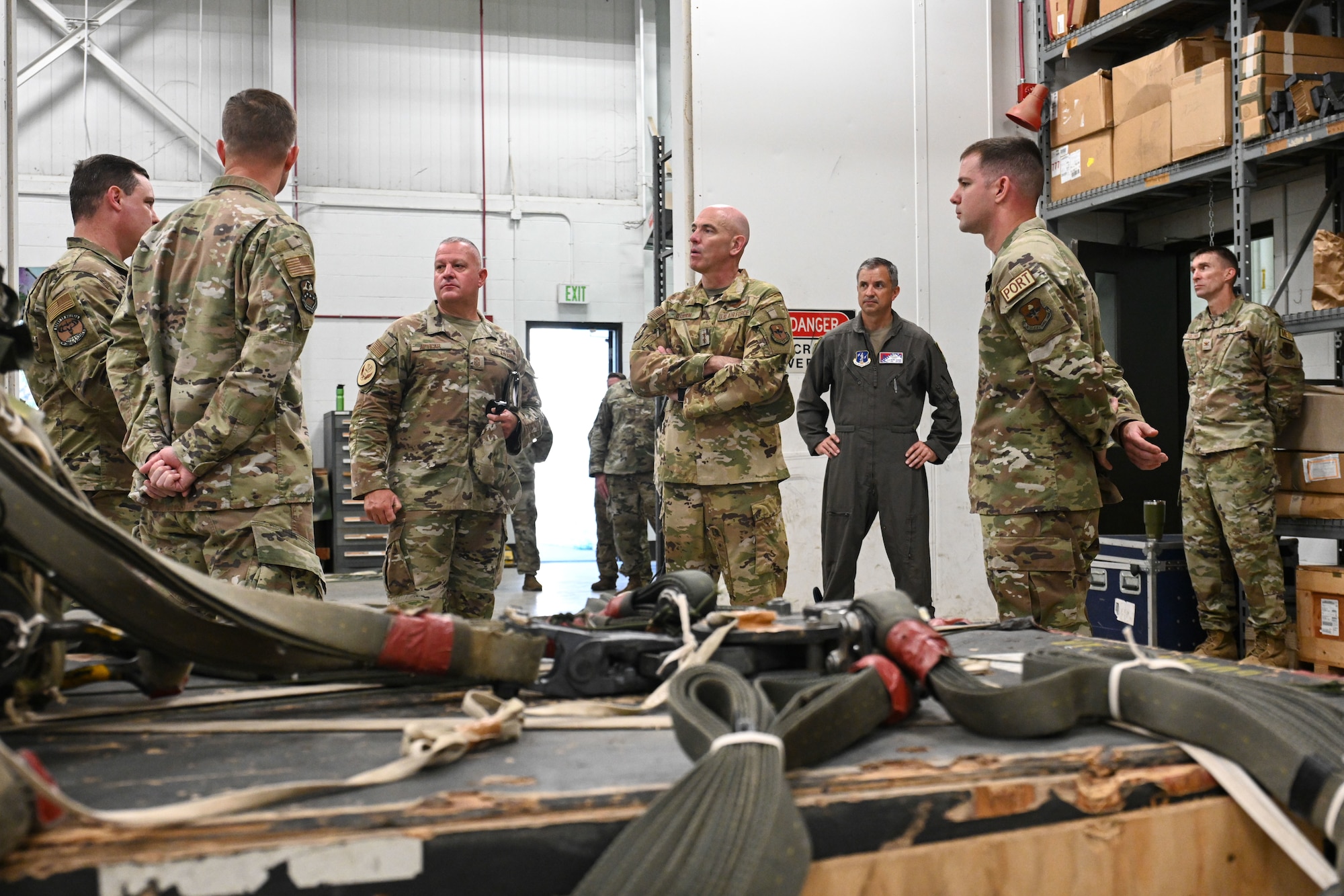 men in uniform speak with each other during a base visit