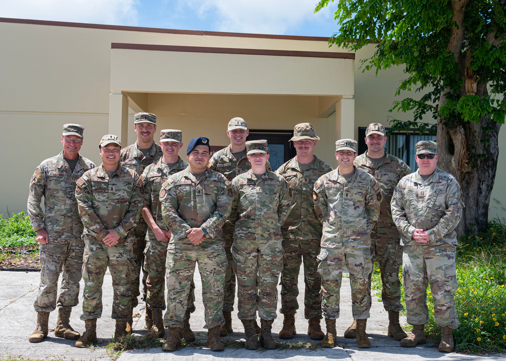 Brig. Gen. Thomas Palenske, commander of the 36th Wing, Col. Larry Fenner, vice commander of the 36th Wing, take a group photo with new company grade officers during a flight commander course at Andersen Air Force Base, Guam, Aug. 17, 2023. The goal of the course was to build, refine, and develop company grade officer’s leadership and ability to support the four major roles of command: execute the mission, manage resources, improve the unit, and lead people. (U.S. Air Force photo by Staff Sgt. Aubree Owens)