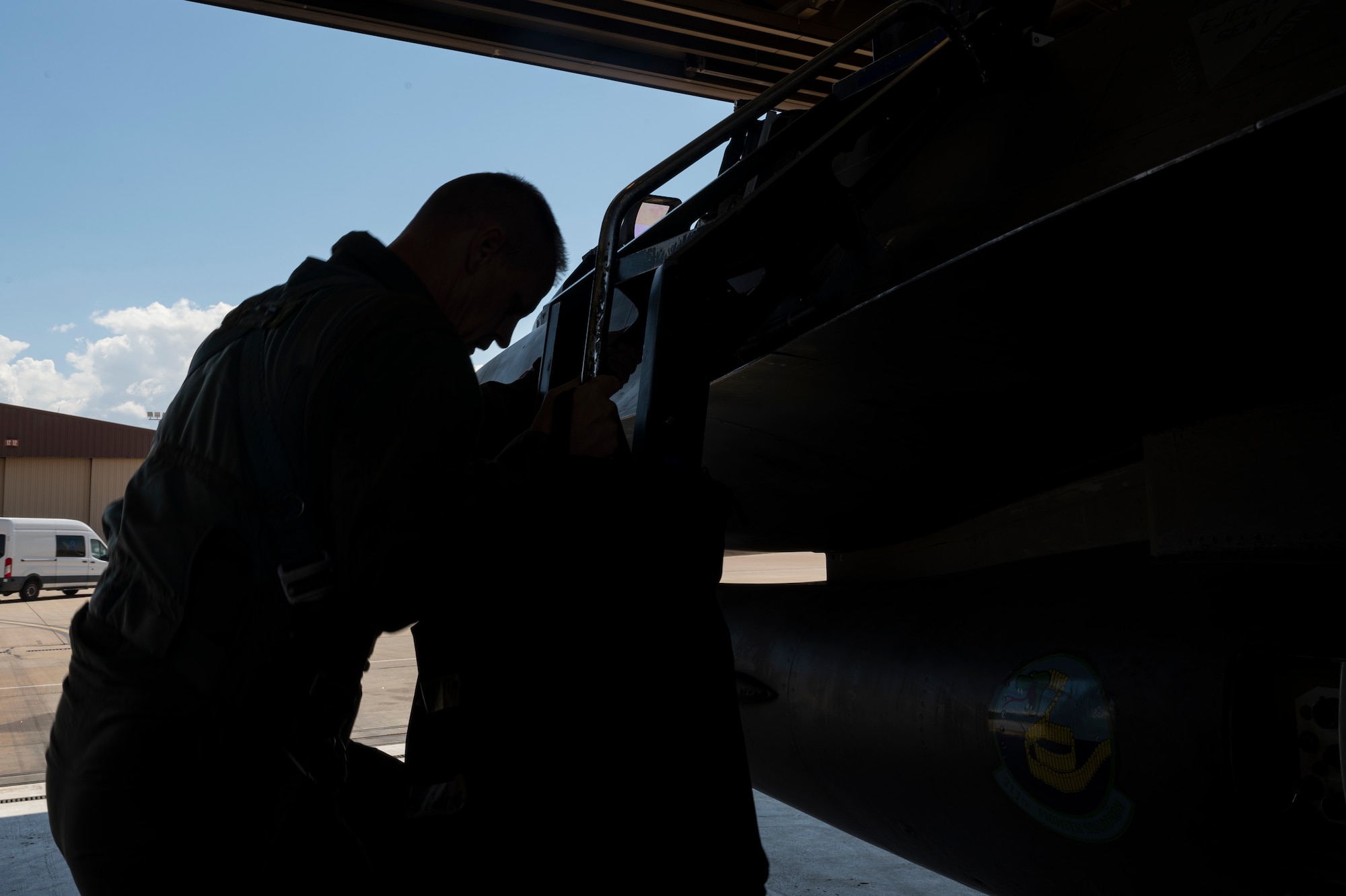 U.S. Air Force Chief Master Sgt. Jeffrey Martin, 49th Wing command chief, climbs into an F-16 Viper at Holloman Air Force Base, New Mexico, Aug. 15, 2023.