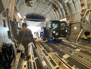 Cargo is downloaded from an aircraft.