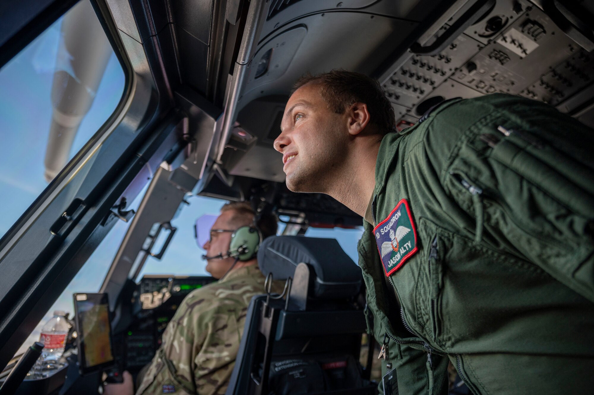 Royal Air Force Flight Lt. Jason Alty, looks out the window of a RAF A400M Atlas during a familiarization flight over Hawaii during Mobility Guardian 23, July 10, 2023. MG23 features seven participating countries - Australia, Canada, France, Japan, New Zealand, United Kingdom, and the United States - operating approximately 70 mobility aircraft across multiple locations spanning a 3,000 mile exercise area. Our Allies and partners are one of our greatest strengths and a key strategic advantage. MG23 is an opportunity to deepen our connections with regional Allies and partners using bold initiatives. (U.S. Air Force photo by Senior Airman Tiffany Del Oso)
