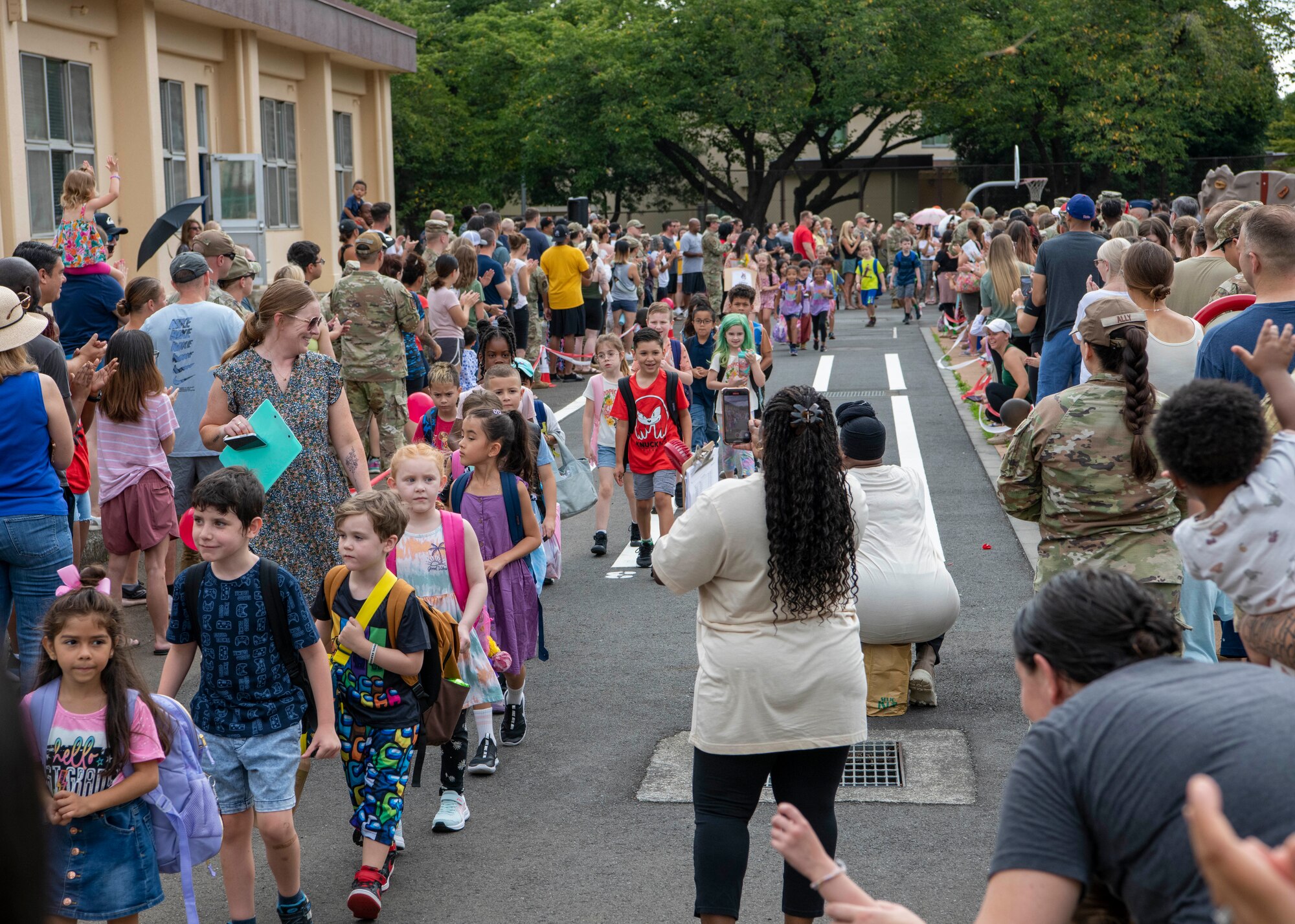 Students walk in a line.