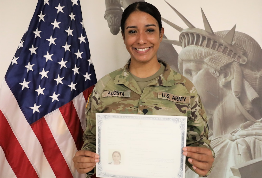 U.S. Pennsylvania Army National Guard Soldier Spc. Jennifer Acosta Tejada, 55th Maneuver Enhancement Brigade (MEB), 28th Infantry Division, celebrates her U.S. citizenship after taking the Naturalization Oath of Allegiance to the United States of America while serving on a CONUS mission on August 10, 2023. Acosta, originally from the Dominican Republic, received her citizenship through her military service with the Pennsylvania Army National Guard under the Naturalization Through Service program. (U.S. Army photo by Sgt. Vail Forbeck)