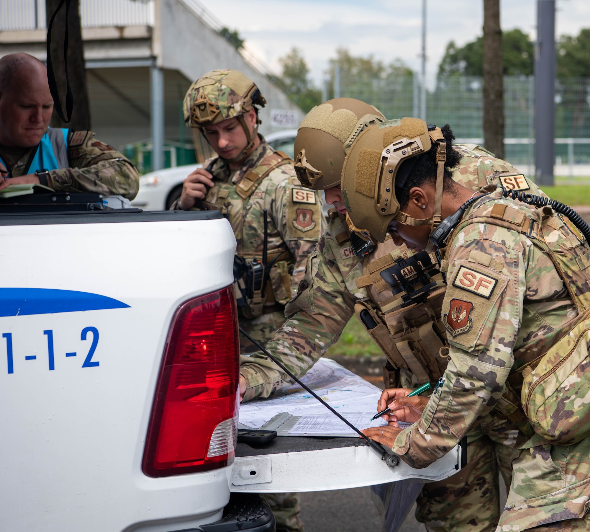 Airmen look at checklist.