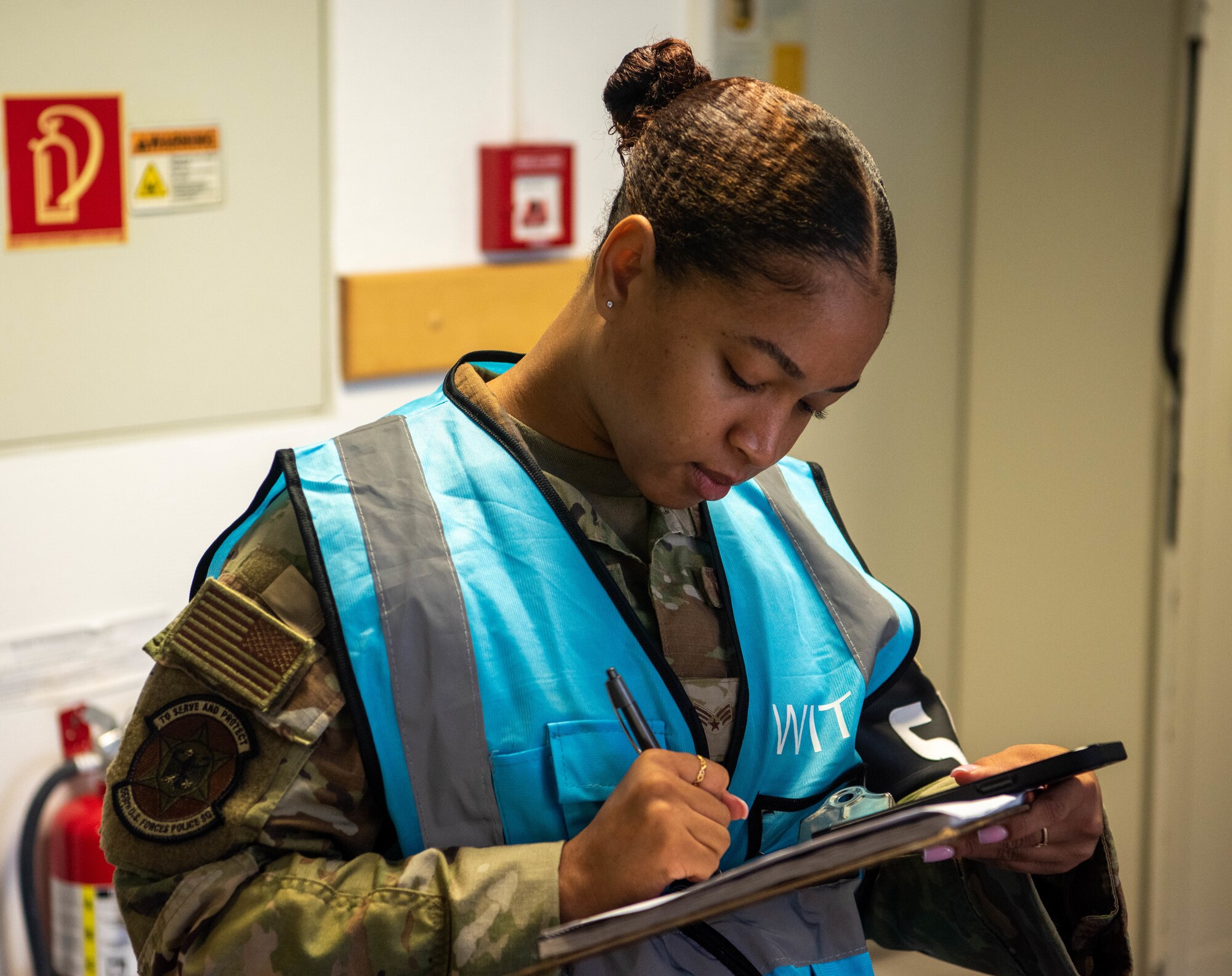 Airman takes notes.