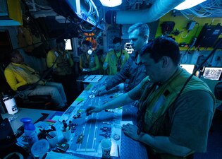 USS Gerald R. Ford (CVN 78) plans aircraft arrangement on the flight deck during operations in the Mediterranean Sea.