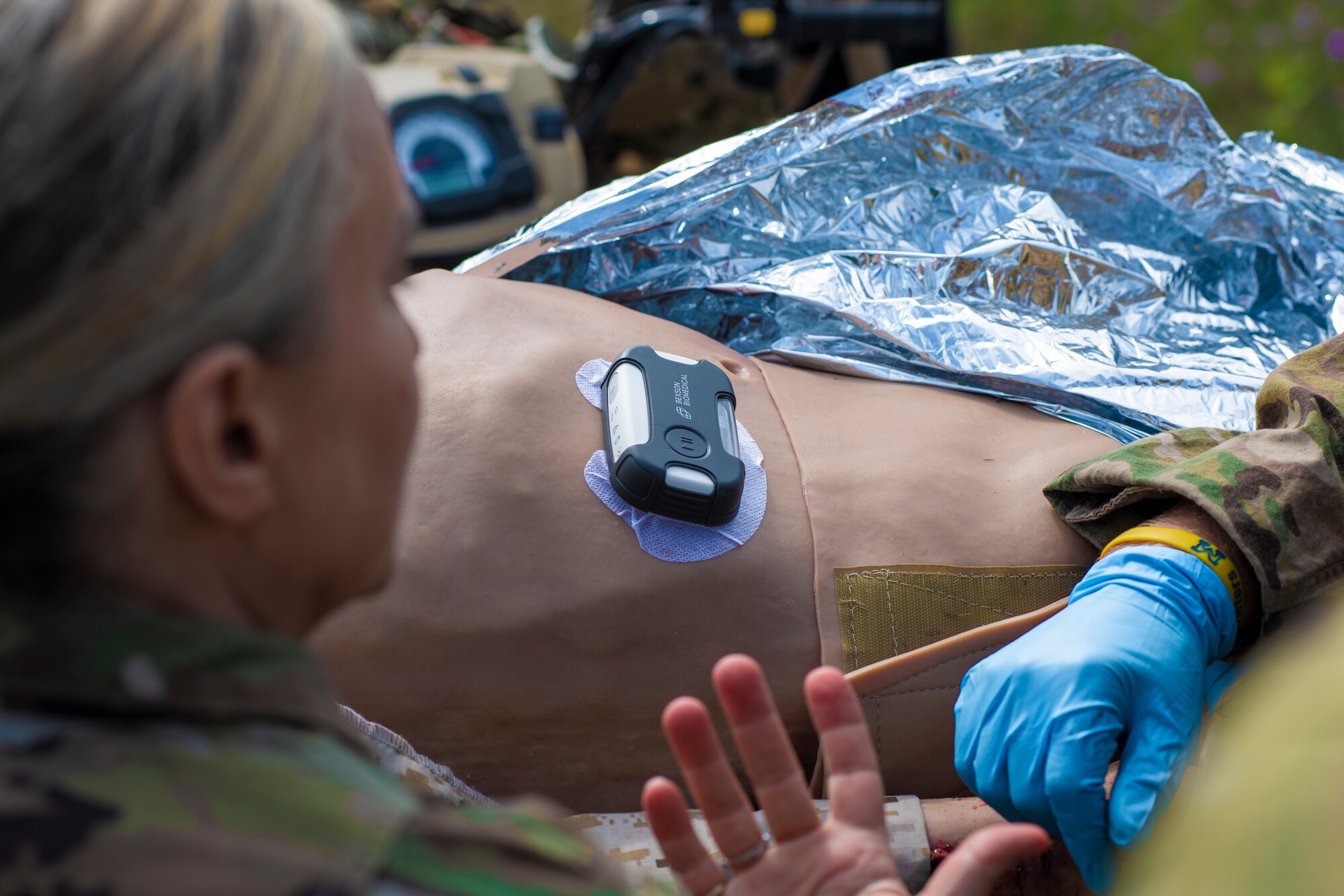U.S. Air Force Maj. Broc Nichelson, a chief nurse with the 110th Medical Group, uses innovative technology to treat a simulated patient during a field exercise as part of Exercise Northern Strike 23 (NS23) in Alpena, Michigan, Aug. 14, 2023