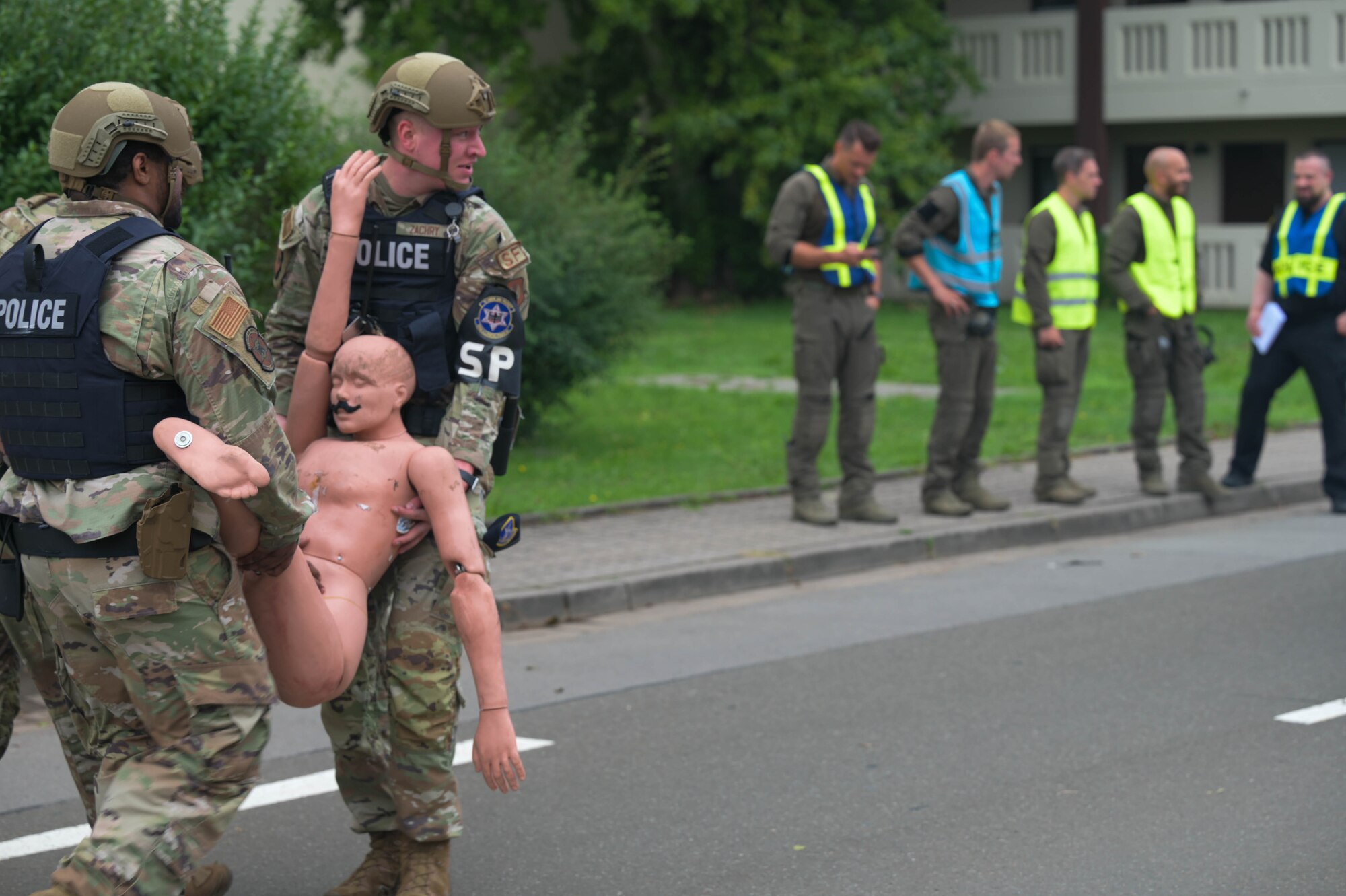 Service members carry dummy.