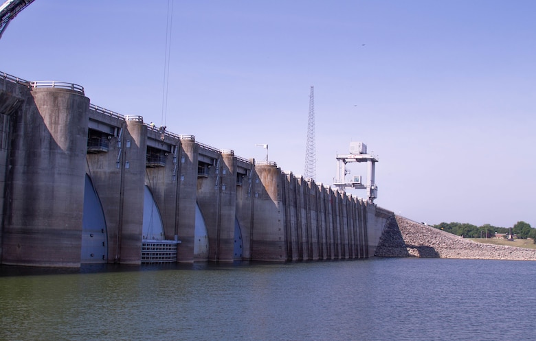 Dam at Truman Lake shown with stoplog being lowered by crane on right hand end. Taken on June 21, 2023.