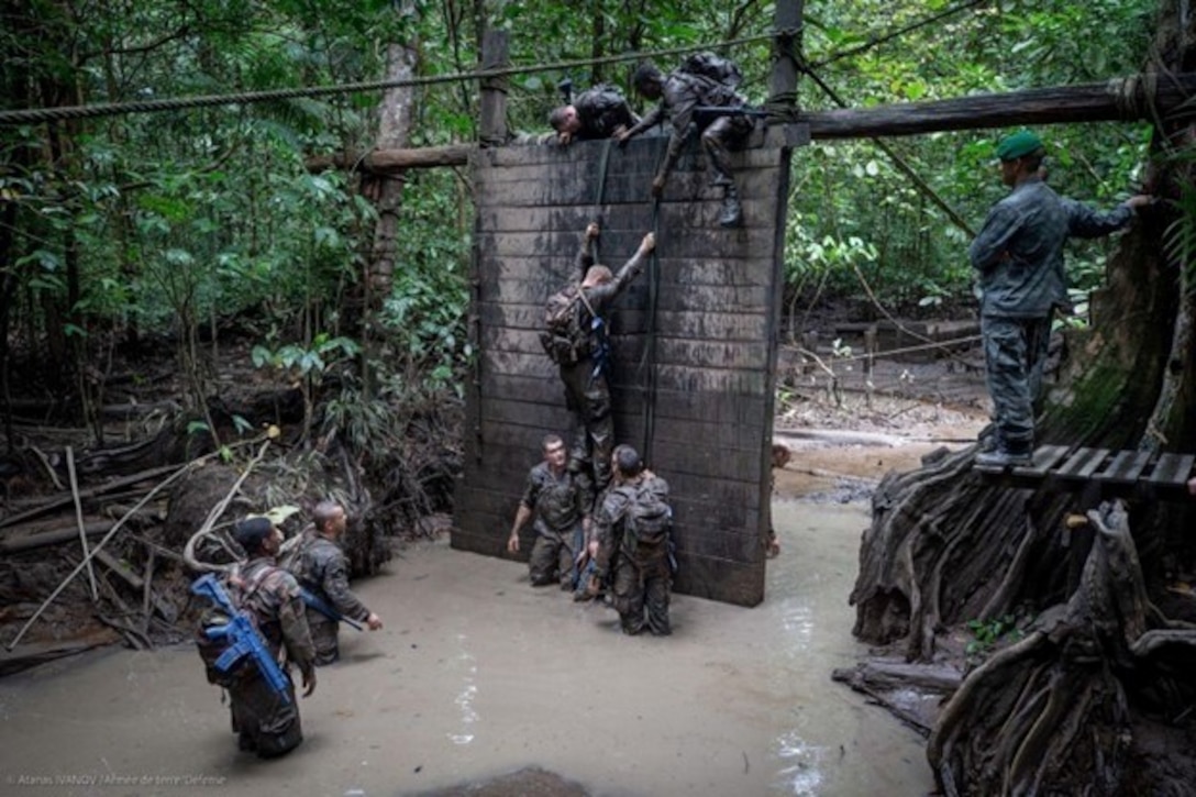 A Marine Raider with Marine Forces Special Operations Command participates in an obstacle course during the French Foreign Legion’s Jaguar Course at French Guiana, Feb 19 – April 14, 2023. The Jaguar Course is an international course consisting of eight weeks designed to train platoon-level tactics in the jungle environment. (U.S. Marine Corps courtesy photo)