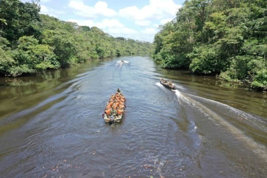 A Marine Raider with Marine Forces Special Operations Command, navigate the Centre d’Entraînement à la Forêt Équatoriale training center by boat during the French Foreign Legion’s Jaguar Course at French Guiana, Feb 19 – April 14, 2023. The Jaguar Course is an international course consisting of eight weeks designed to train platoon-level tactics in the jungle environment. (U.S. Marine Corps courtesy photo)