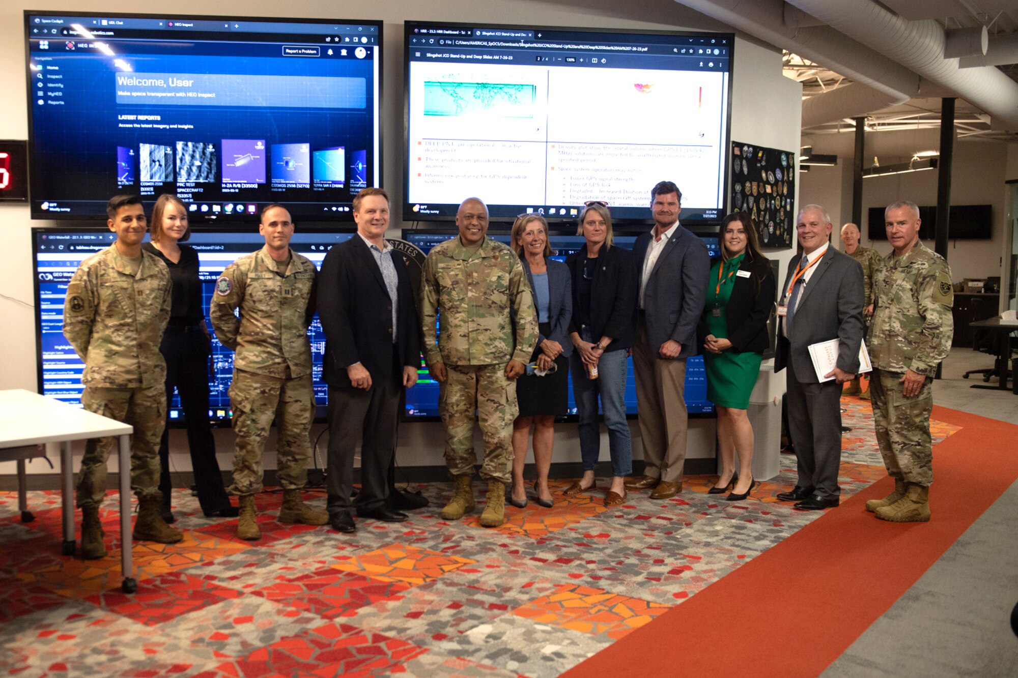 Group photo with civilian and military personnel