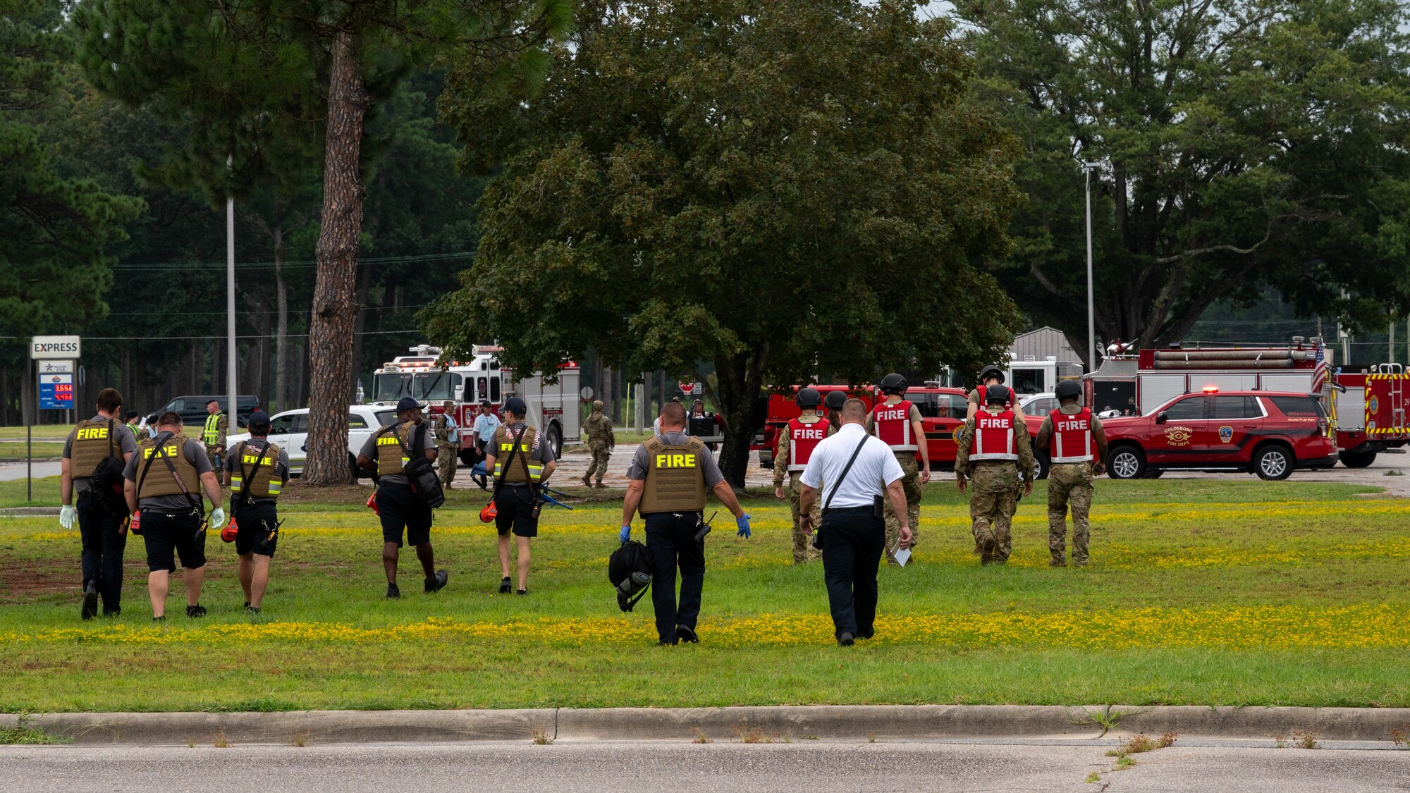 U.S. Air Force Airmen assigned to the 4th Security Forces Squadron and Wayne County first responders prepare to perform an after-action-report after completing an active-shooter training exercise at Seymour Johnson Air Force Base, North Carolina, August 17, 2023. Active-shooter exercises like this test the ability of first responders from the base and local community to save lives and neutralize a threat. (U.S. Air Force photo by Airman 1st Class Leighton Lucero)