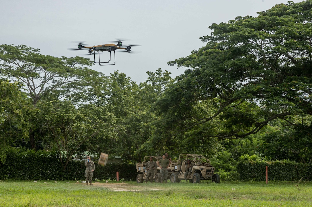 U.S. Marines from Combat Logistics Battalion 8(CLB-8), Combat Logistics Regiment 2 (CLR-2), 2nd Marine Logistics Group (2nd MLG), receive a resupply of MREs from a U.S. Marine Corps Tactical Resupply Vehicle 150 (TRV) unmanned aircraft system during UNITAS LXIV Exercise in Coveñas, Colombia, July 14, 2023. UNITAS, taking place in Colombia this year, is the world’s longest-running annual multinational maritime exercise that focuses on enhancing interoperability among multiple nations and joint forces during littoral and amphibious operations in order to build on existing regional partnerships and create new enduring relationships that promote peace, stability, and prosperity in the U.S. Southern Command’s area of responsibility. (U.S. Marine Corps photo by Lance Cpl. Christian Salazar)