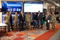 Group photo with civilian and military personnel