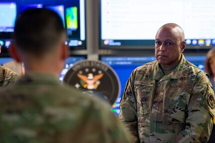 Man in military uniform listening to brief
