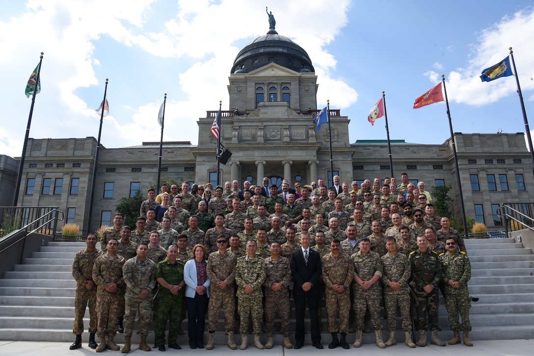 Personnel from the U.S. and partner nations, including Kazakhstan, Kyrgyzstan, Mongolia, Pakistan, Tajikistan and Uzbekistan, pose together at the Montana State Capitol Aug. 18, 2023, in Helena, Montana. RC23 is an annual, multi-national U.S. Central Command-sponsored exercise conducted by U.S. forces in partnership with Central and South Asia nations. (U.S. Army National Guard photo by Sgt. 1st Class Terra C. Gatti)