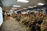 Personnel from the U.S. and partner nations, including Kazakhstan, Kyrgyzstan, Mongolia, Pakistan, Tajikistan and Uzbekistan, conduct an after action review following Exercise Regional Cooperation 23 Aug. 18, 2023, at the Helena Aviation Readiness Center in Helena, Montana. RC23 is an annual, multi-national U.S. Central Command-sponsored exercise conducted by U.S. forces in partnership with Central and South Asia nations. (U.S. Army National Guard photo by Sgt. 1st Class Terra C. Gatti)