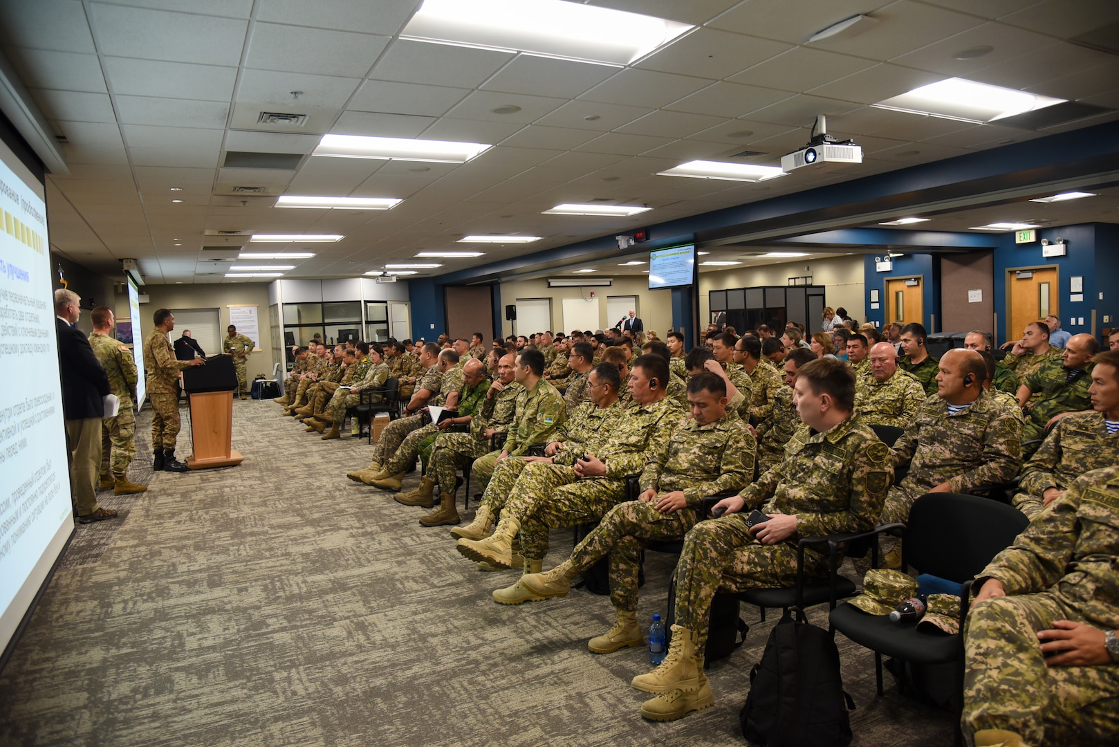 Personnel from the U.S. and partner nations, including Kazakhstan, Kyrgyzstan, Mongolia, Pakistan, Tajikistan and Uzbekistan, conduct an after action review following Exercise Regional Cooperation 23 Aug. 18, 2023, at the Helena Aviation Readiness Center in Helena, Montana. RC23 is an annual, multi-national U.S. Central Command-sponsored exercise conducted by U.S. forces in partnership with Central and South Asia nations. (U.S. Army National Guard photo by Sgt. 1st Class Terra C. Gatti)