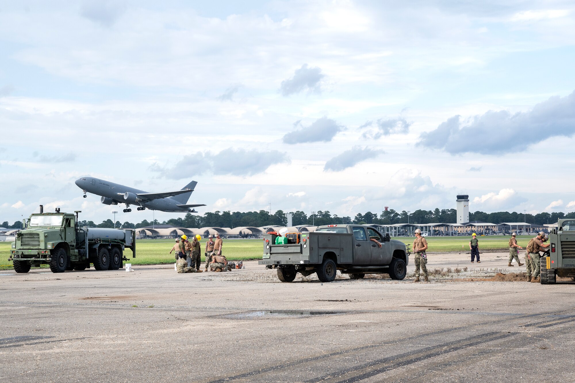 U.S. Navy Seabees assigned to Naval Mobile Construction Battalion 11 conduct airfield damage repair as part of Large Scale Exercise (LSE) 2023 at Seymour Johnson Air Force Base, North Carolina, Aug. 10, 2023. LSE 2023 demonstrates the Navy’s and Marine Corps’ ability to employ precise, lethal, and overwhelming force globally across six maritime component commands, seven numbered fleets, and 22 time zones. LSE 2023 merges real-world operations with virtually constructed scenarios to create a realistic training environment that allows Sailors and Marines to train how they will fight, regardless of geographic boundaries. (U.S. Air Force photo by Tech. Sgt. Christopher Hubenthal)