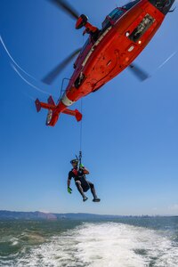 The U.S. Coast Guard San Francisco Sector Search and Rescue (SAR) team rescue diver lowers himself from the Eurocopter MH-65 Dolphin onto the teams ship during the Search and Rescue Exercise (SAREX) in the San Francisco Bay, California on Aug.17, 2023.